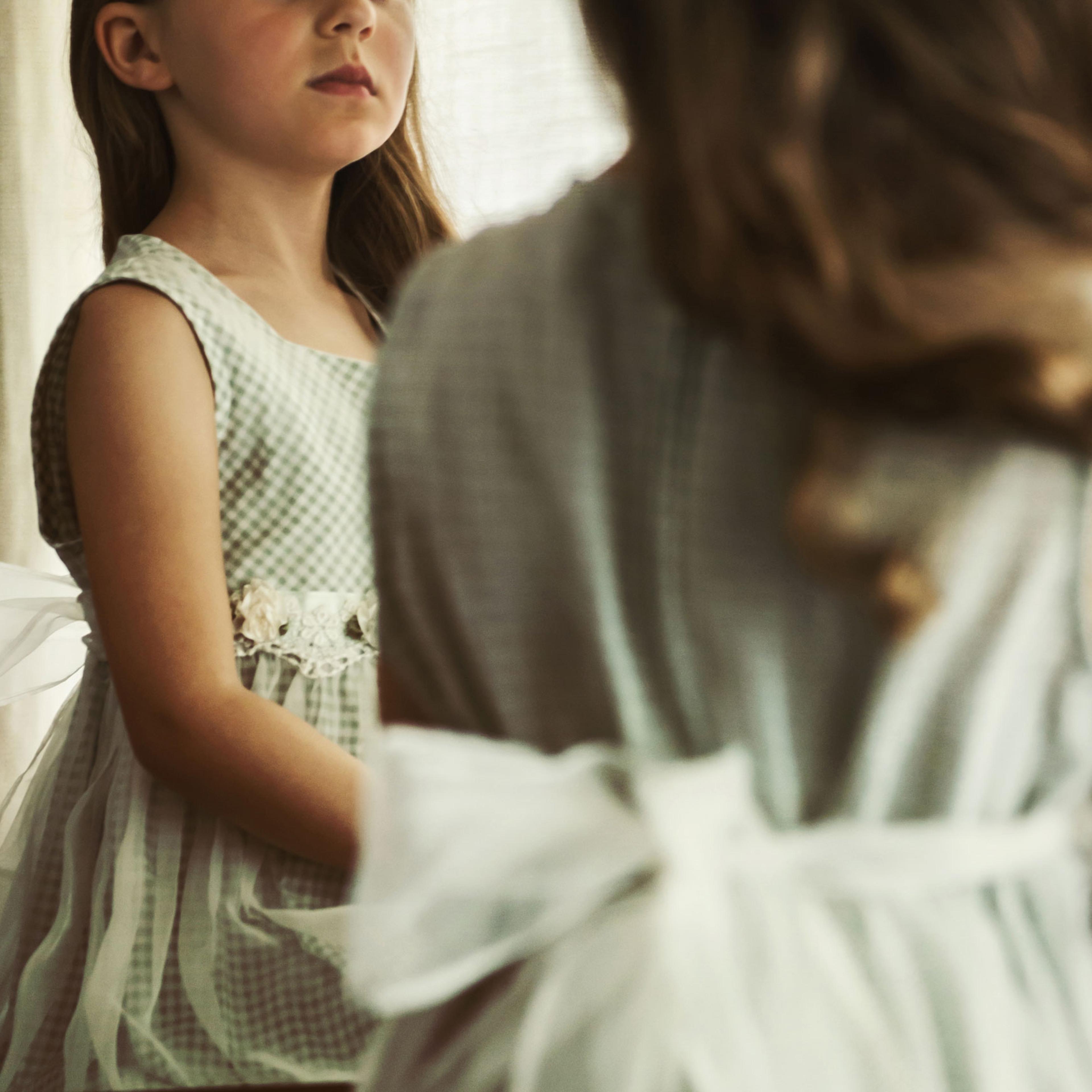 A young girl's reflection in the mirror