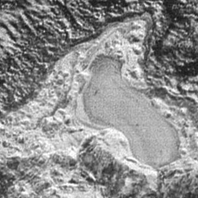 An image captured by NASA's New Horizons spacecraft appears to show a frozen, former lake of liquid nitrogen.