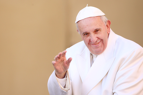 Pope Francis waves to the faithful as he arrives at St. Peter's Square for a meeting with members of 'Padre Pio' Prayer Groups in Vatican City on Feb. 6, 2016.
