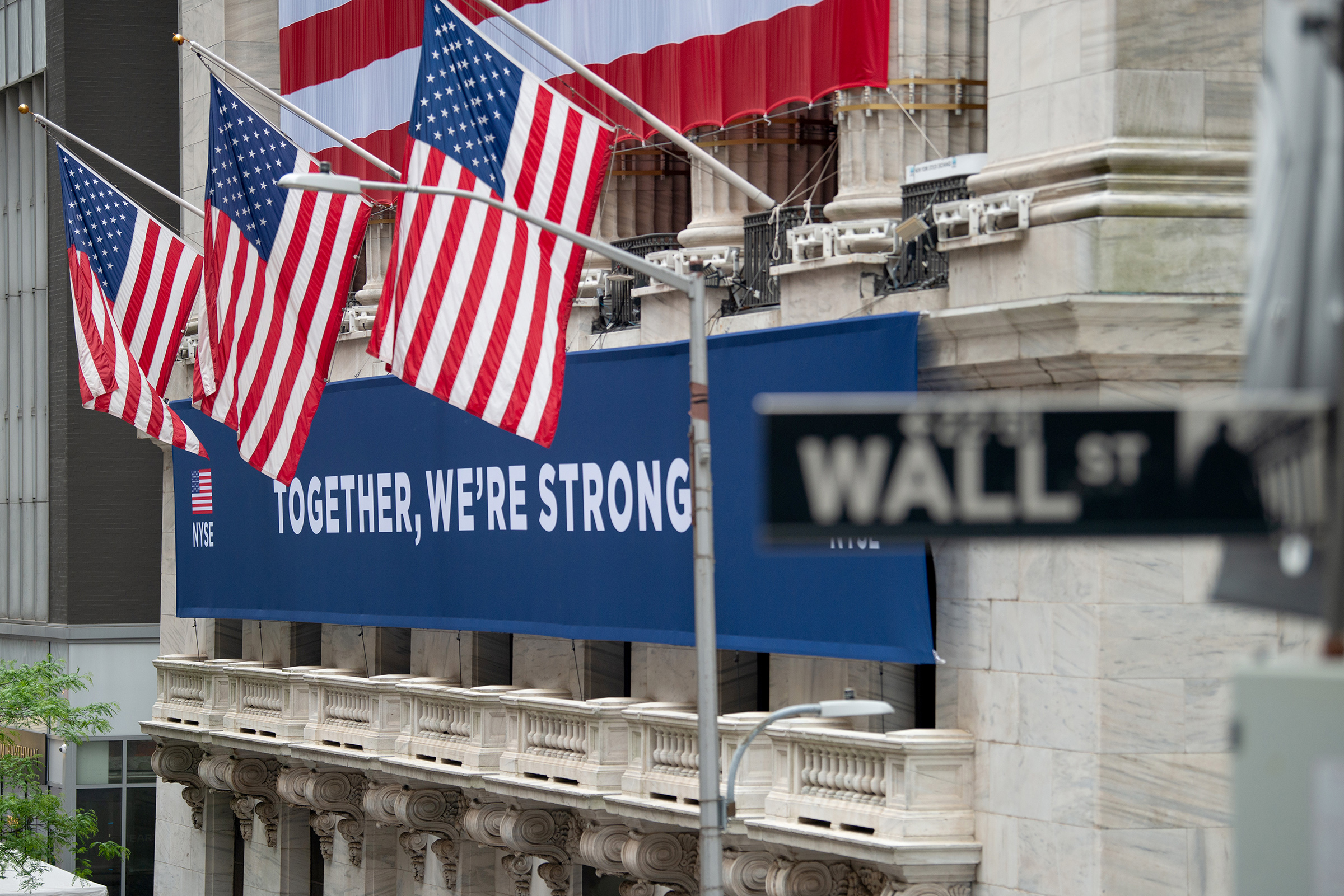 A view of the "Together, We're Strong" banner in front of the New York Stock Exchange on May 28