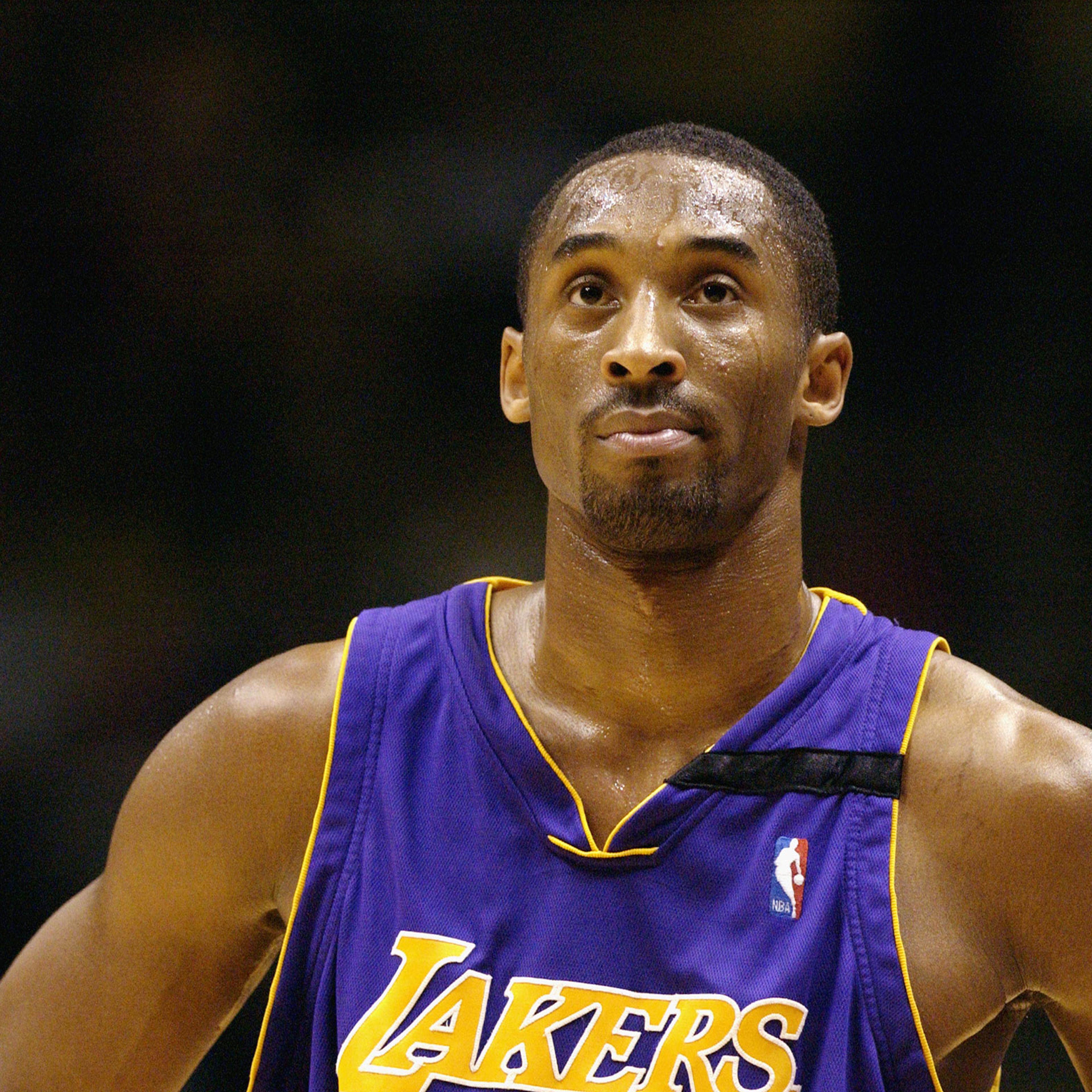 Kobe Bryant of the Los Angeles Lakers looks at the clock during a game against the New Jersey Nets