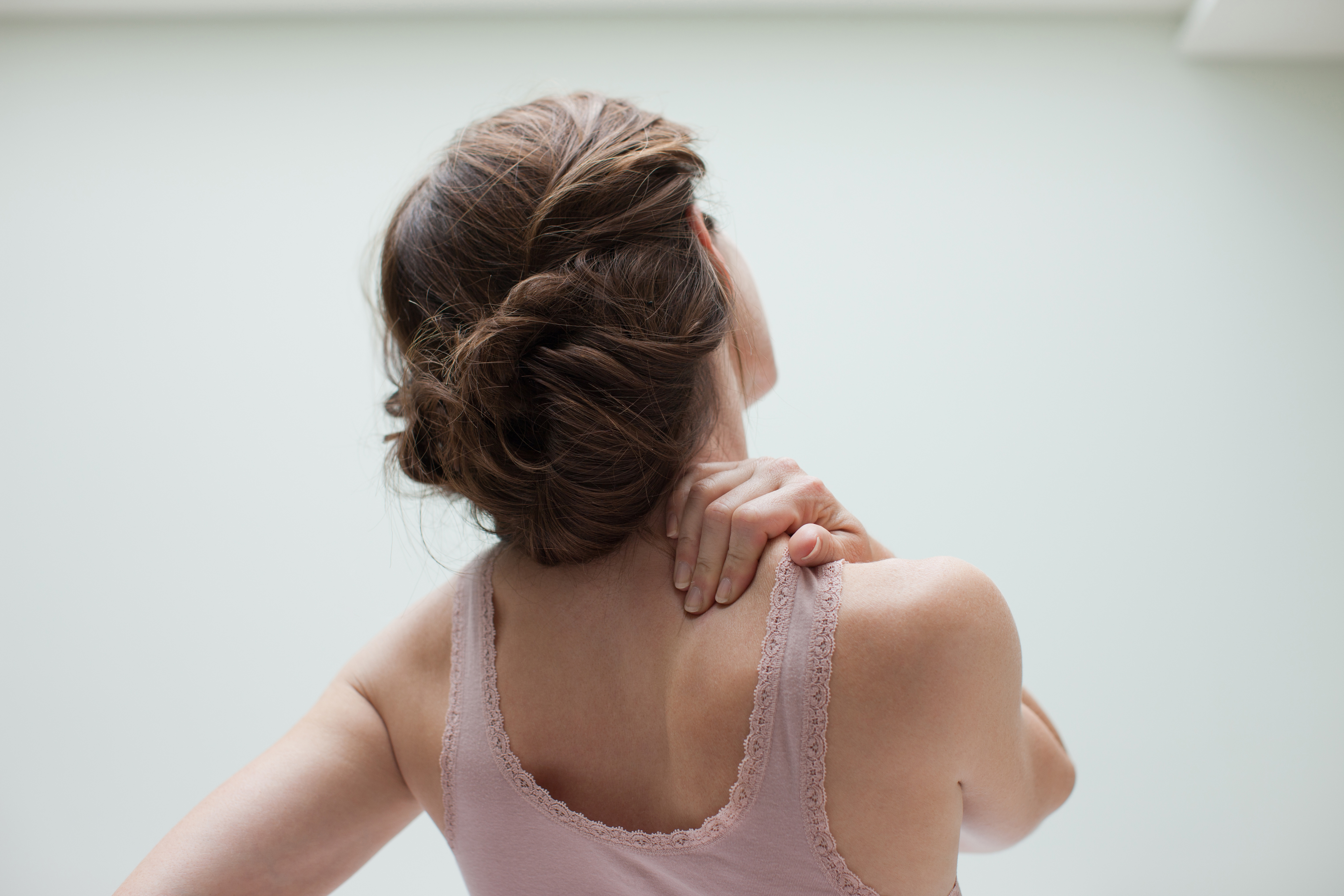 Woman rubbing aching back
