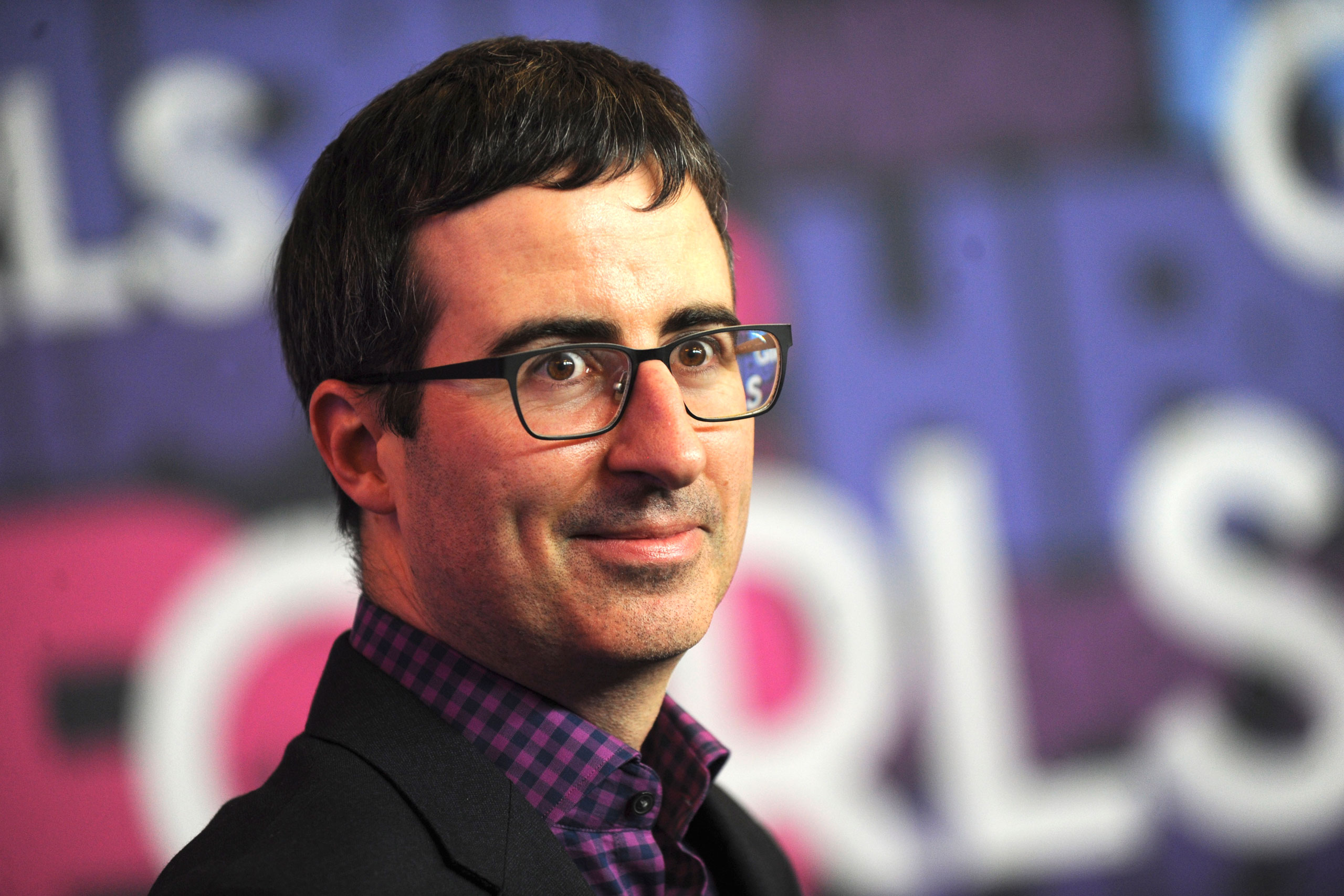 John Oliver attends the 'Girls' season four premiere at American Museum of Natural History on Jan. 5, 2015 in New York City.
