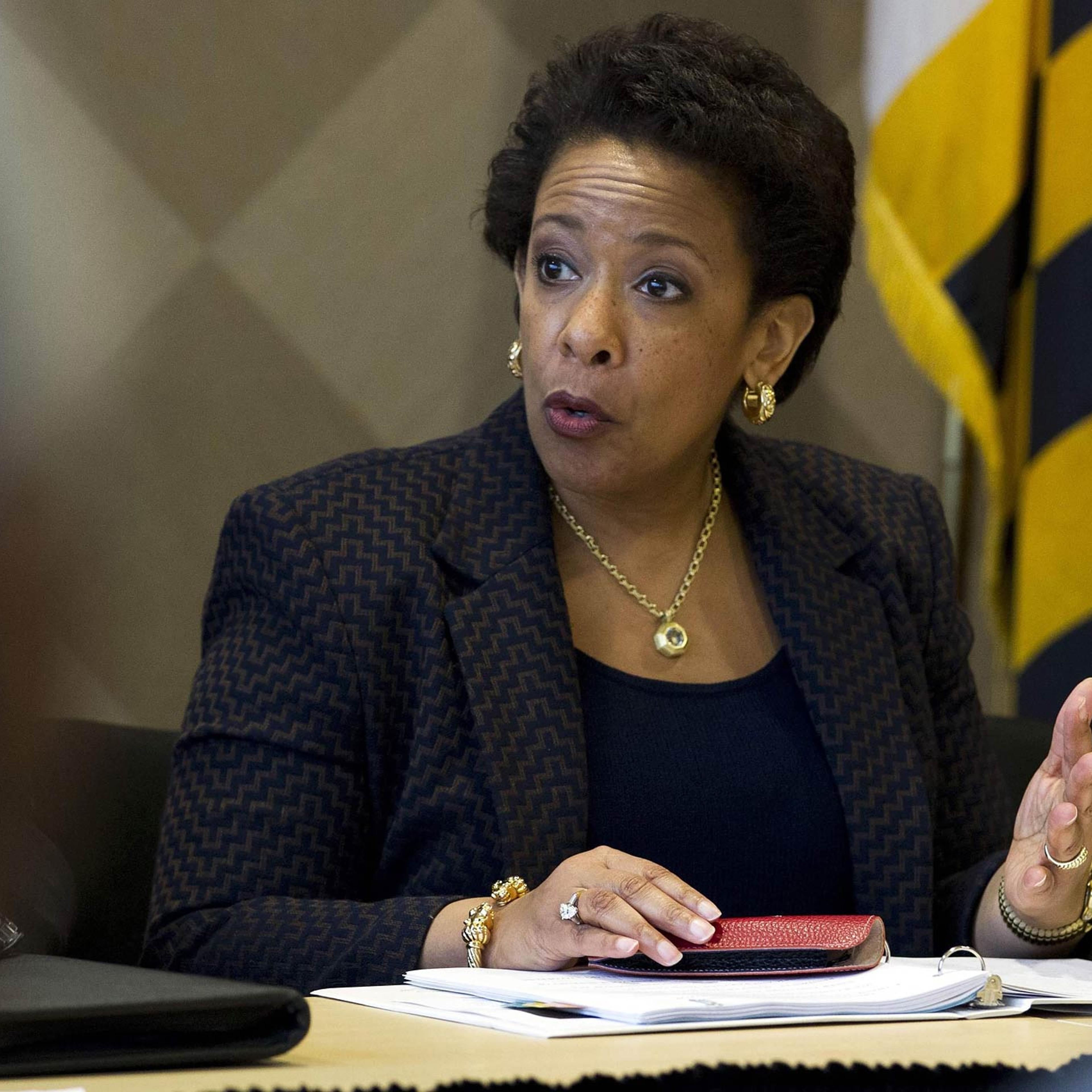 Attorney General Lynch speaks with congressmen and faith leaders after meeting in private with Freddie Gray's family at Baltimore University in Baltimore