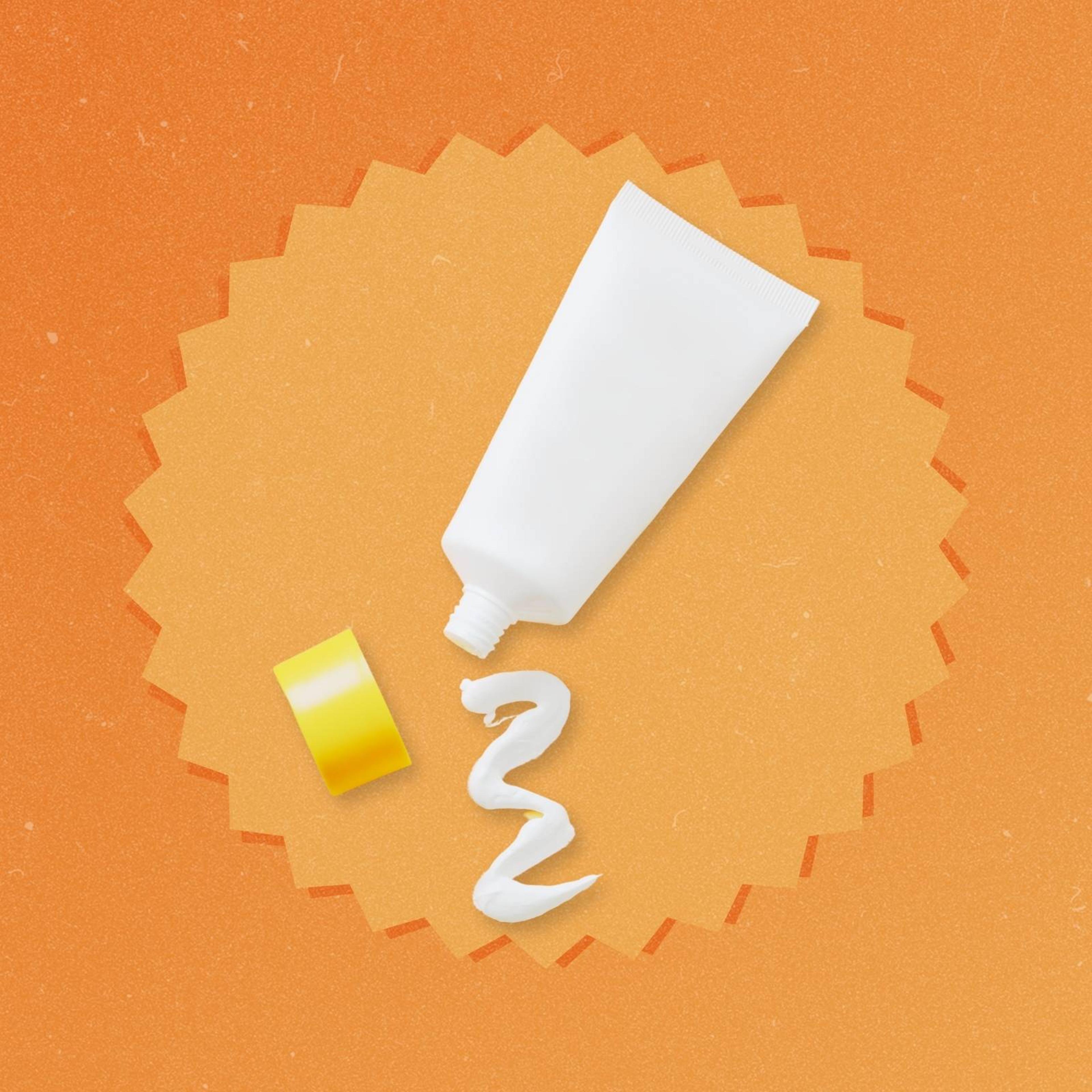 A tube of sunscreen on a bright orange backgroun