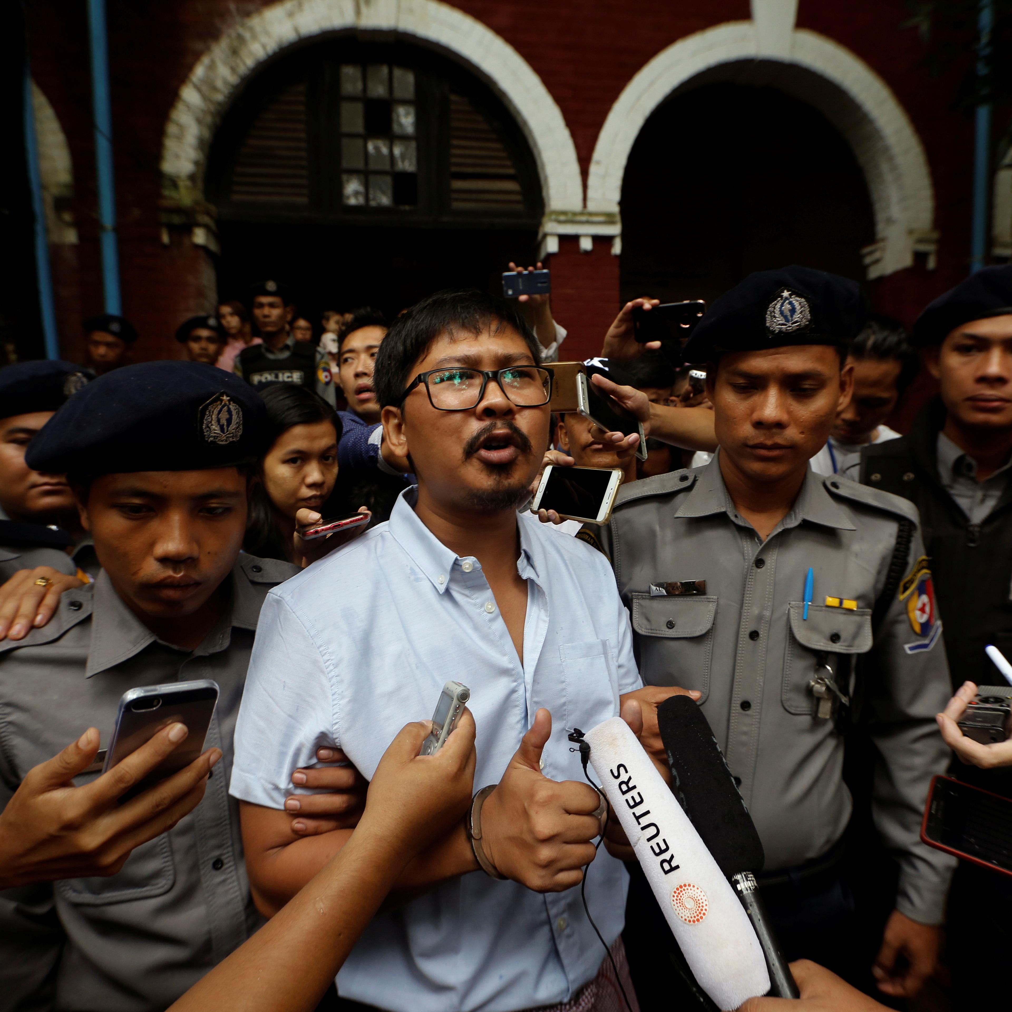Detained Reuters journalist Wa Lone speaks to the media while leaving Insein court in Yangon