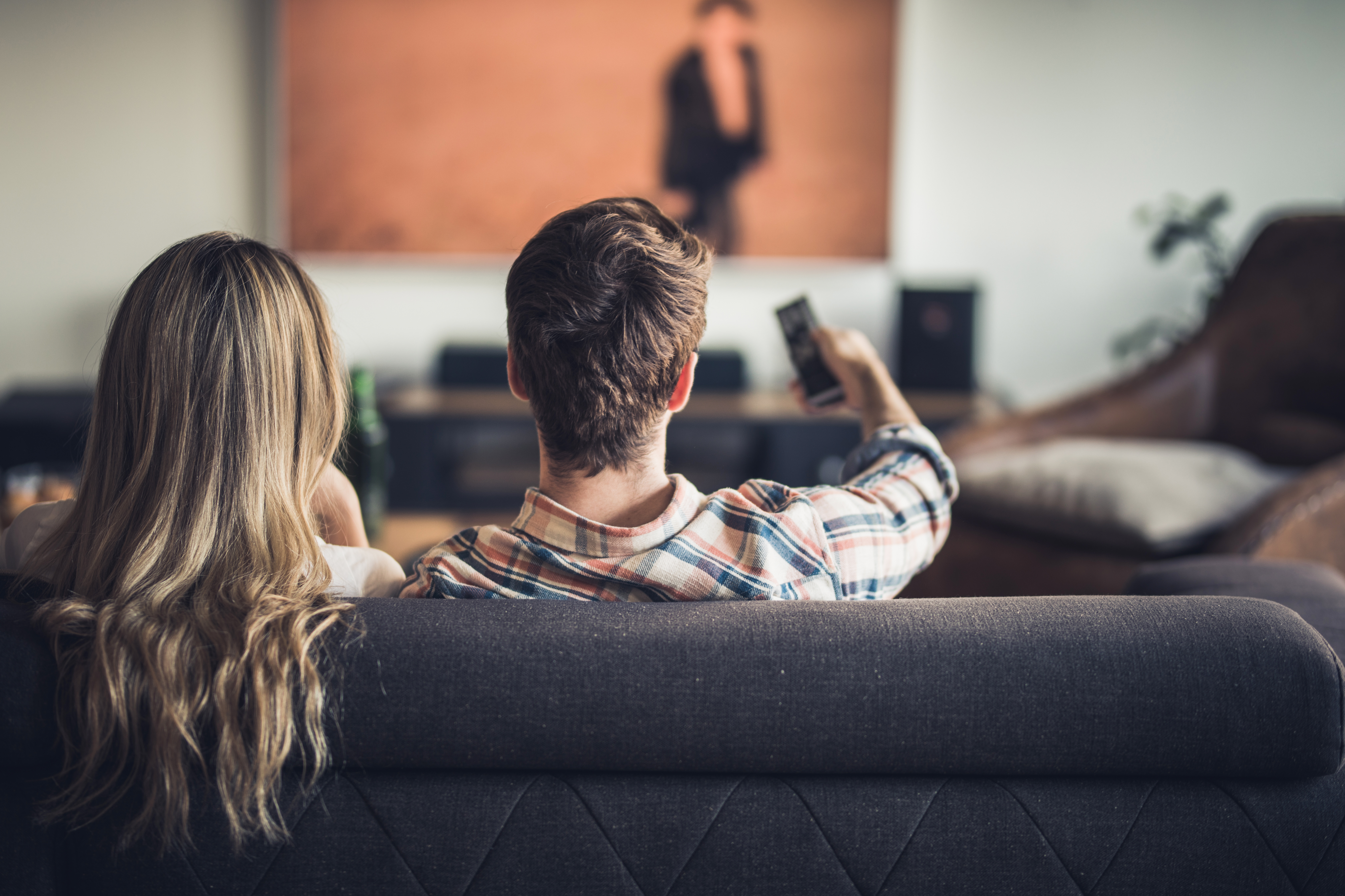 Rear view of a couple watching a movie