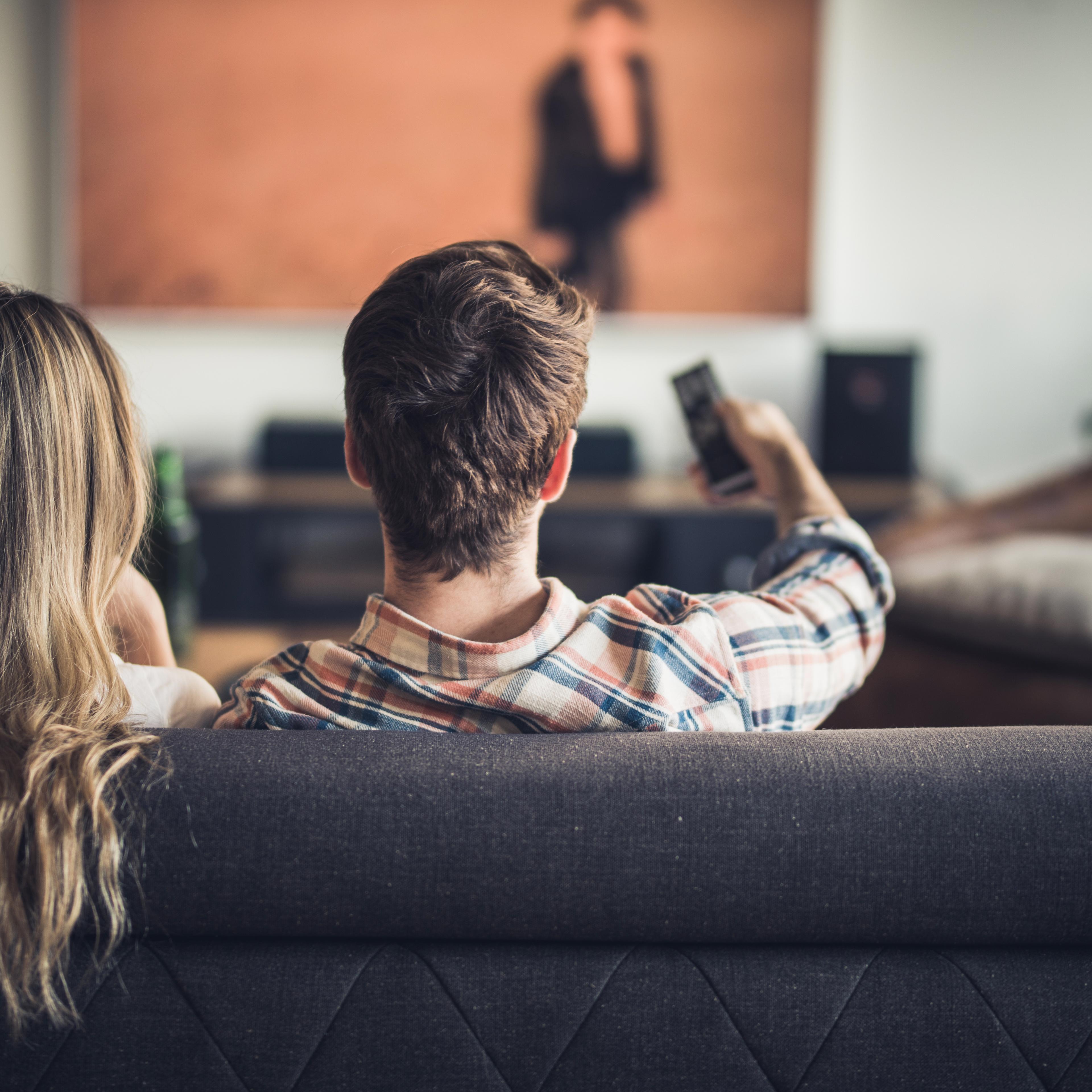Rear view of a couple watching a movie