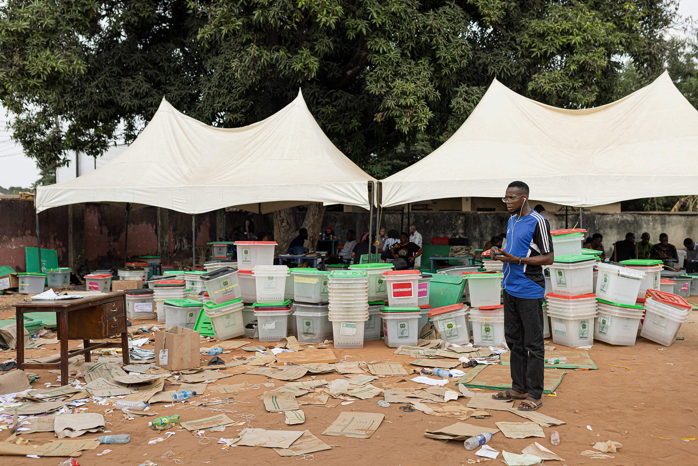 An Independent National Electoral Commission official speaks on the phone at the INEC offices in Awka, Nigeria, on Feb. 26 following the Nigeria presidential and general election.