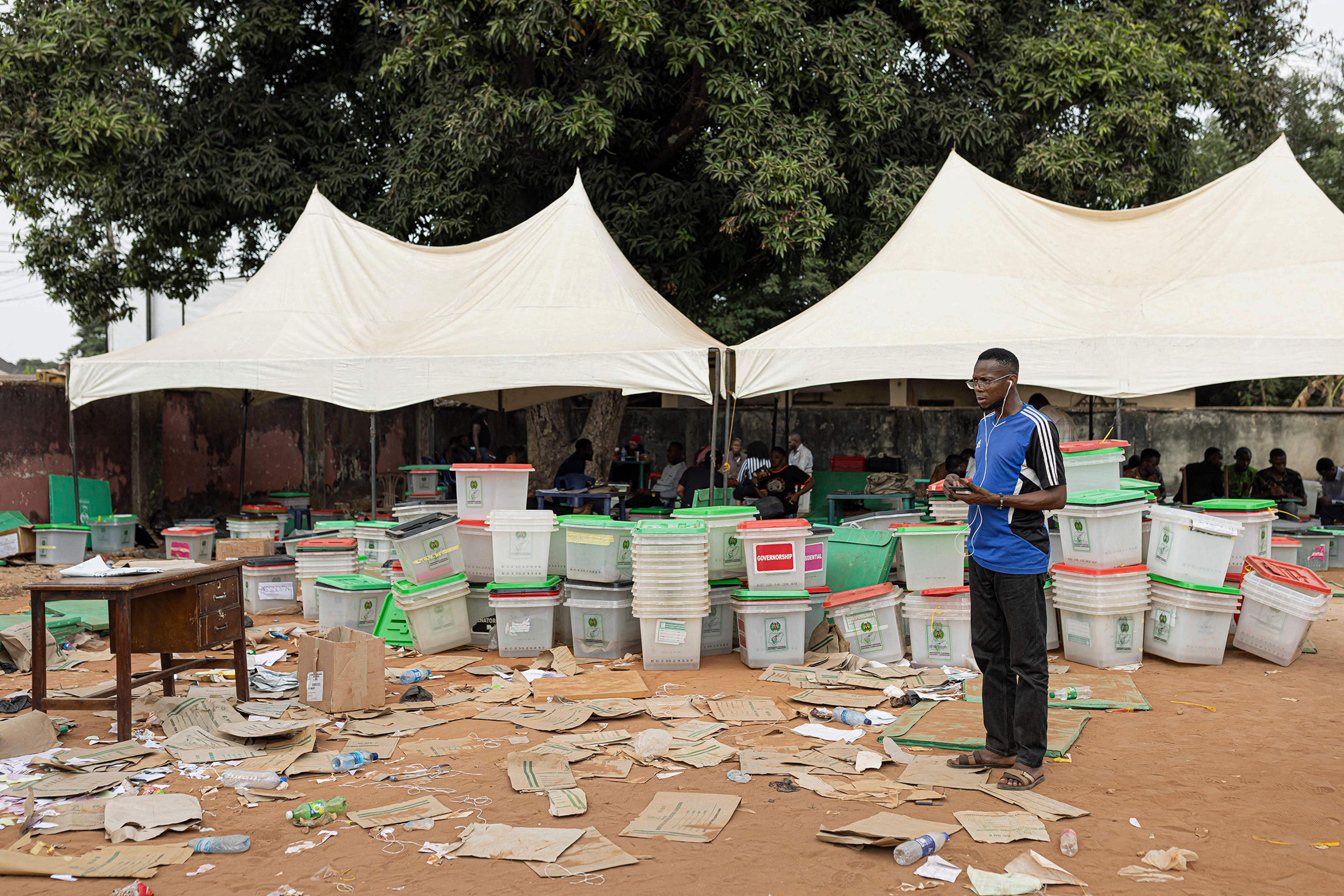 An Independent National Electoral Commission official speaks on the phone at the INEC offices in Awka, Nigeria, on Feb. 26 following the Nigeria presidential and general election.