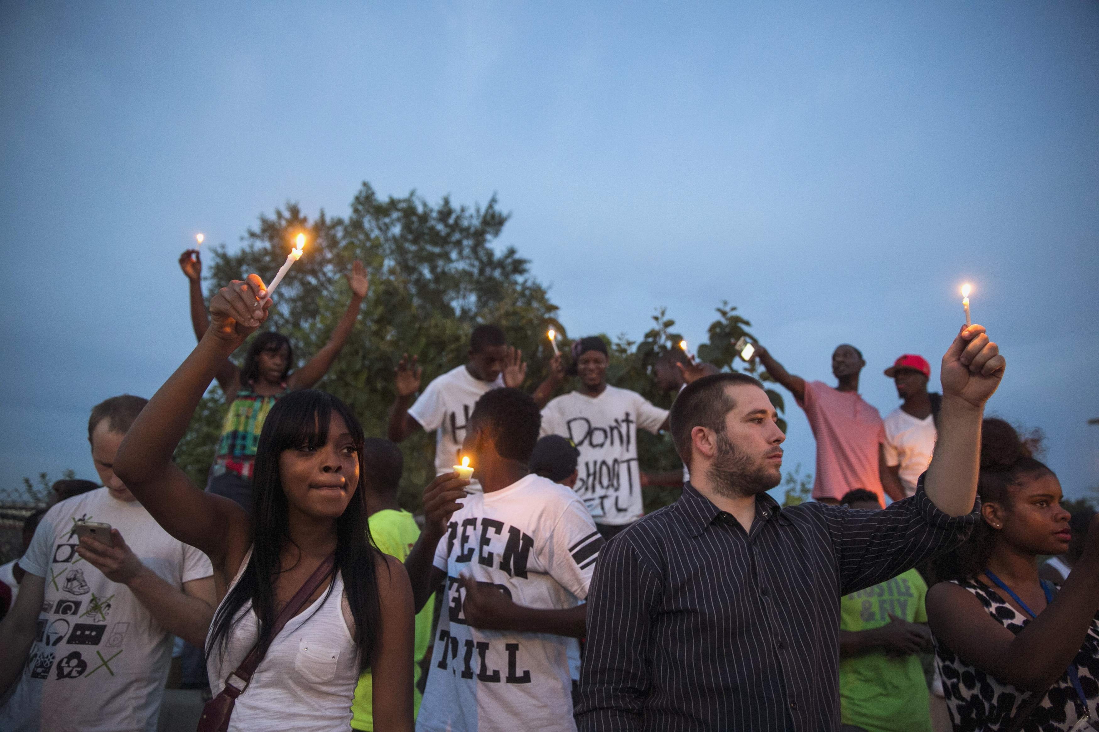 Protesters take part in a peaceful demonstration against shooting of Michael Brown, in Ferguson, Missouri