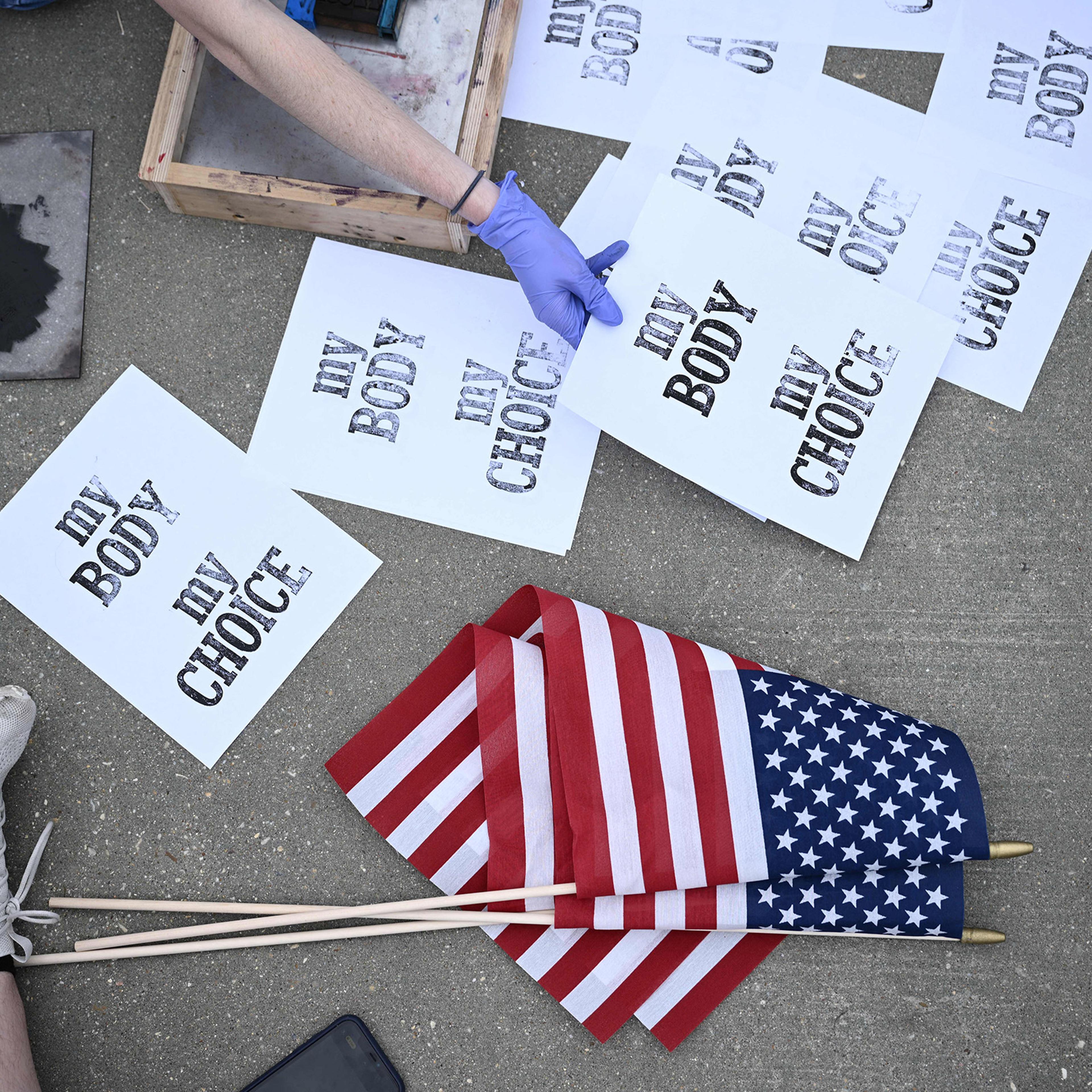 Pro-choice demonstrators make signs in front of the US Supreme Court in Washington, DC, on May 3, 2022.