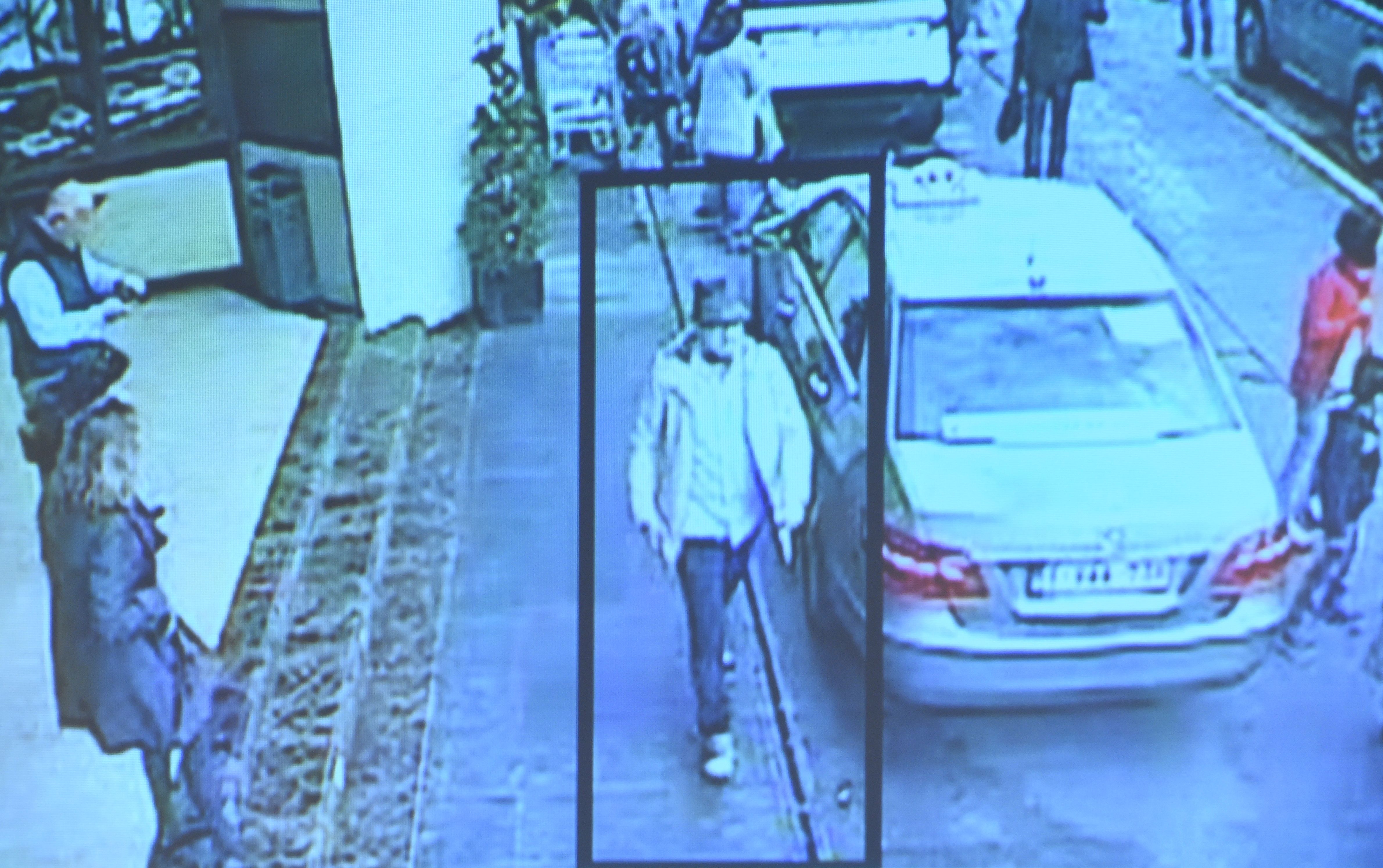 brussels man in hat jacket police