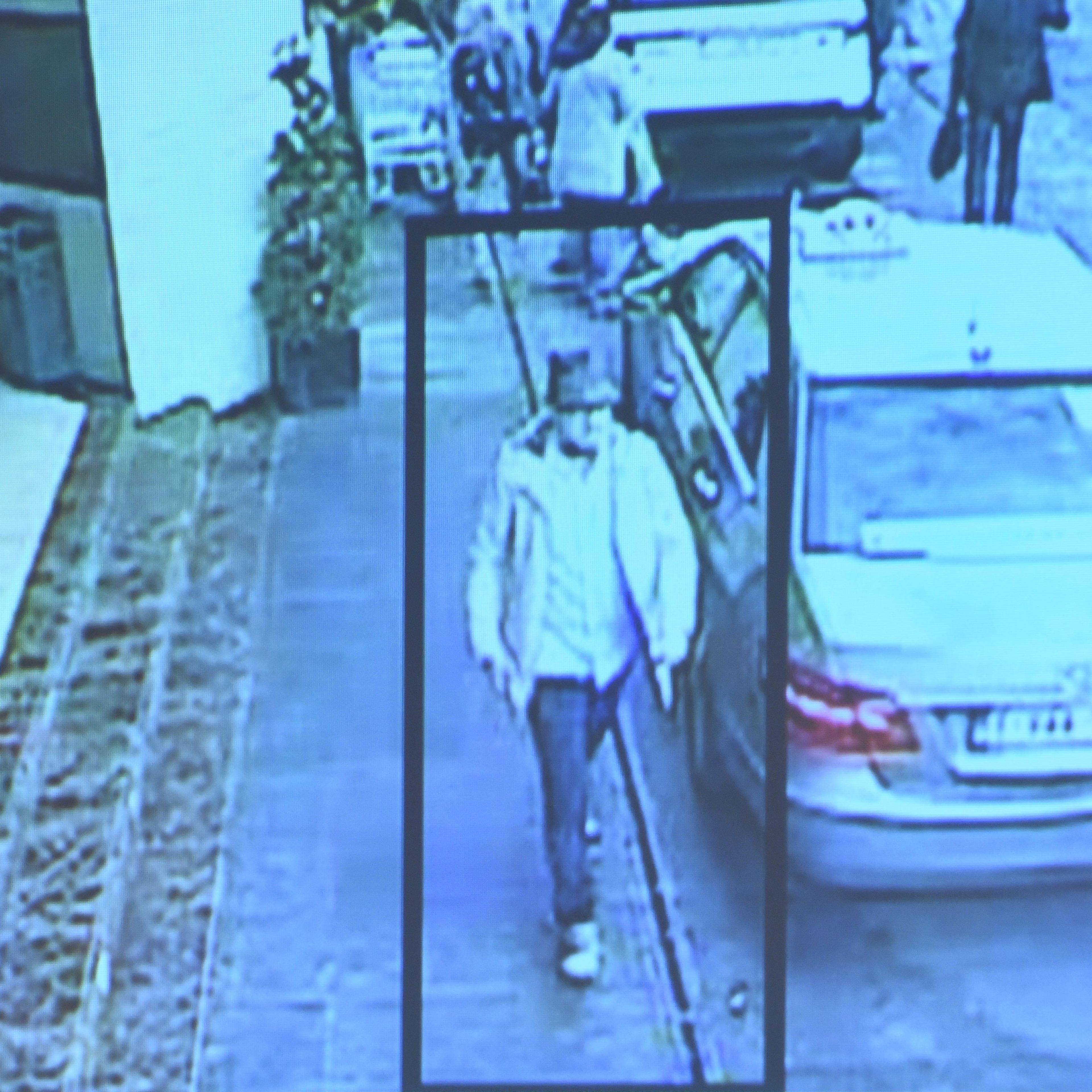 brussels man in hat jacket police