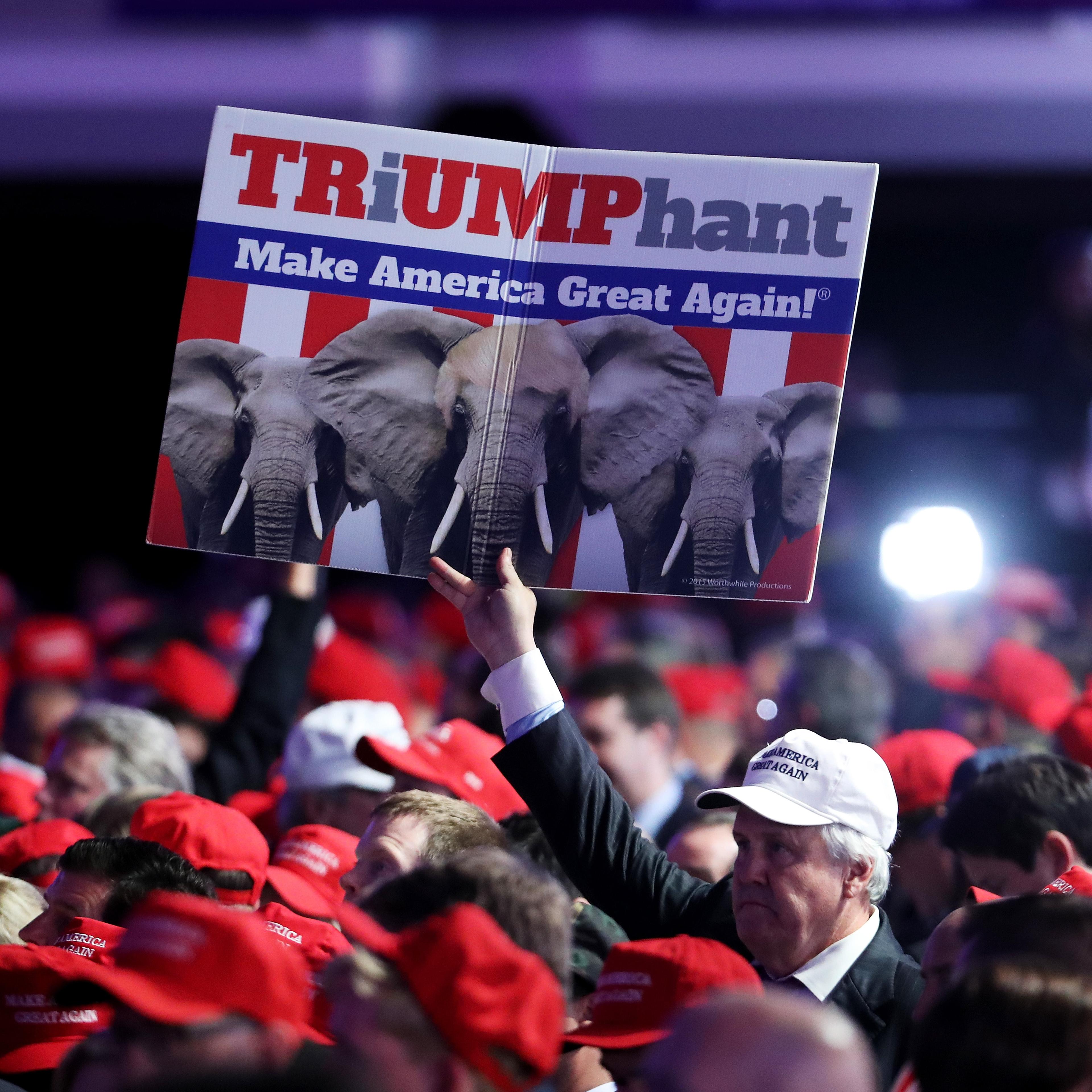 A supporter holds up a sign in support of Republican presidential nominee Donald Trump during the election night event at the New York Hilton Midtown on Nov. 8, 2016.