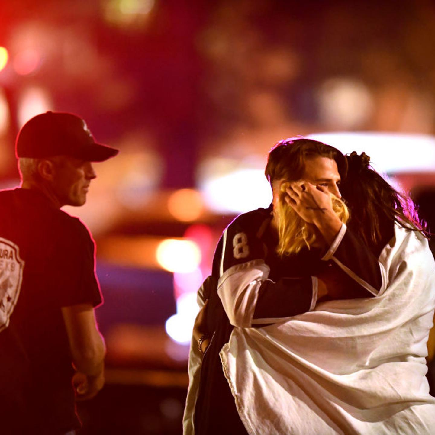 Witnesses console each other near the Borderline Bar at Thousand Oaks Shooting