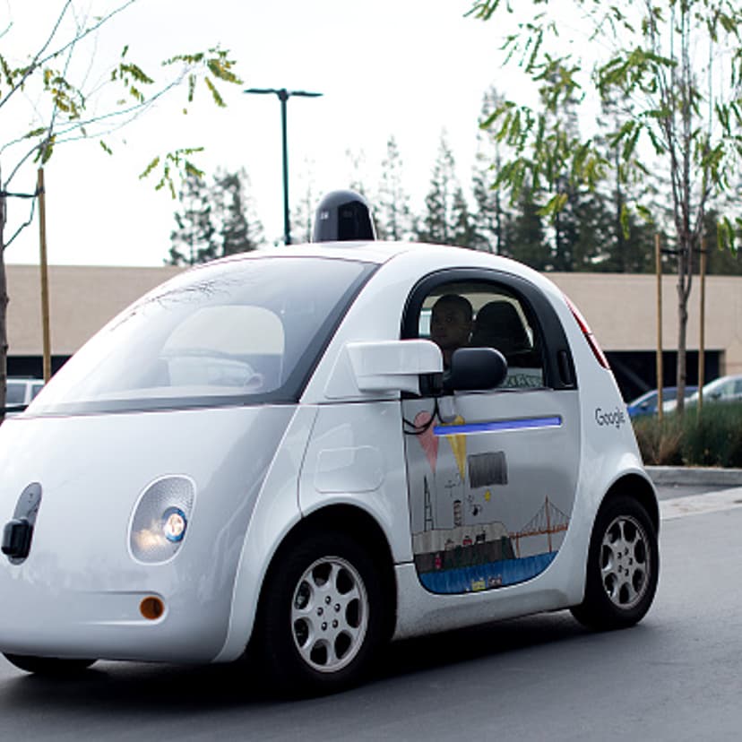 A self-driving car traverses a parking lot at Google's headquarters in Mountain View, California on Jan. 8, 2015.