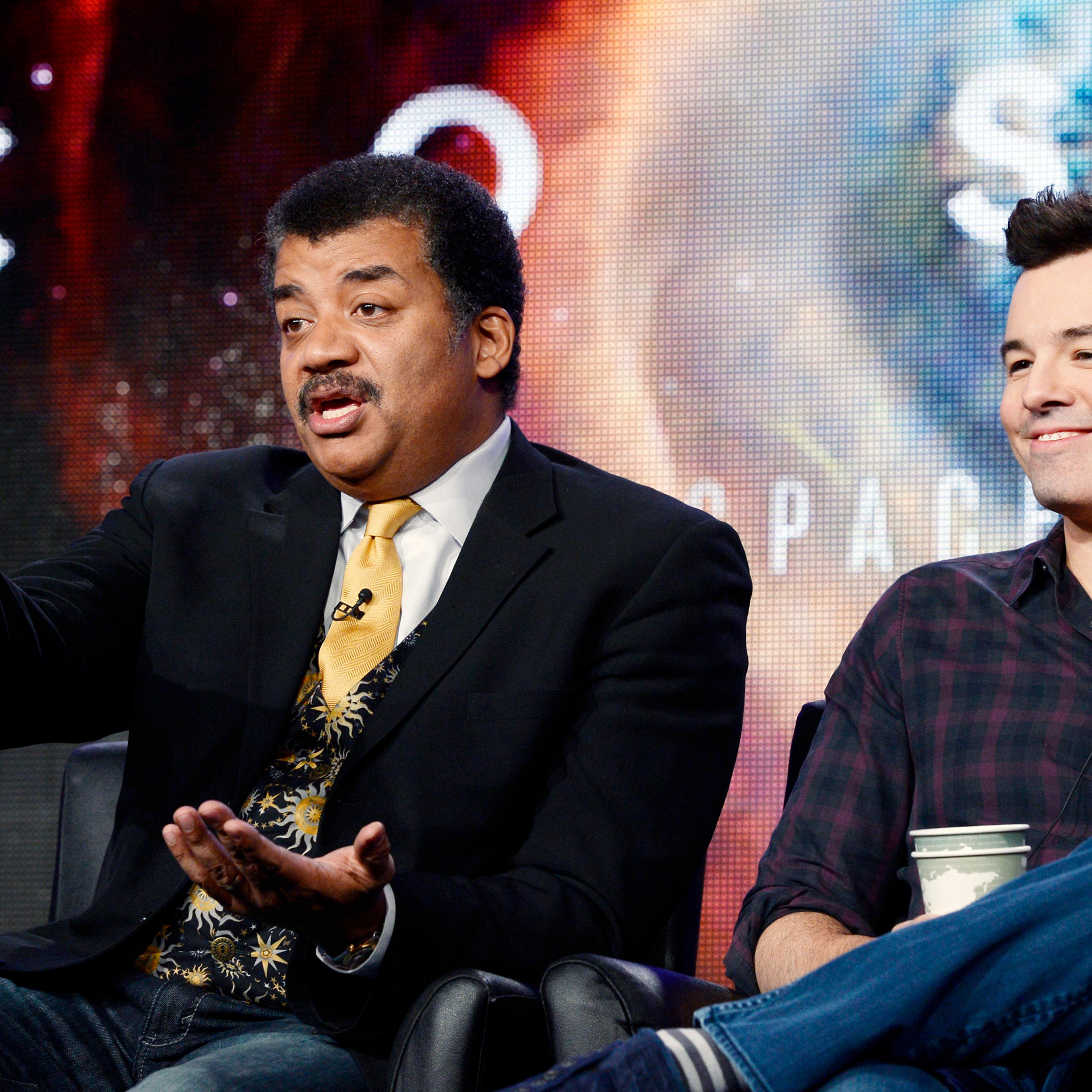 Host Neil DeGrasse Tyson and Seth MacFarlane, executive producer of "Cosmos", participate in Fox Broadcasting Company's part of the Television Critics Association (TCA) Winter 2014 presentations in Pasadena
