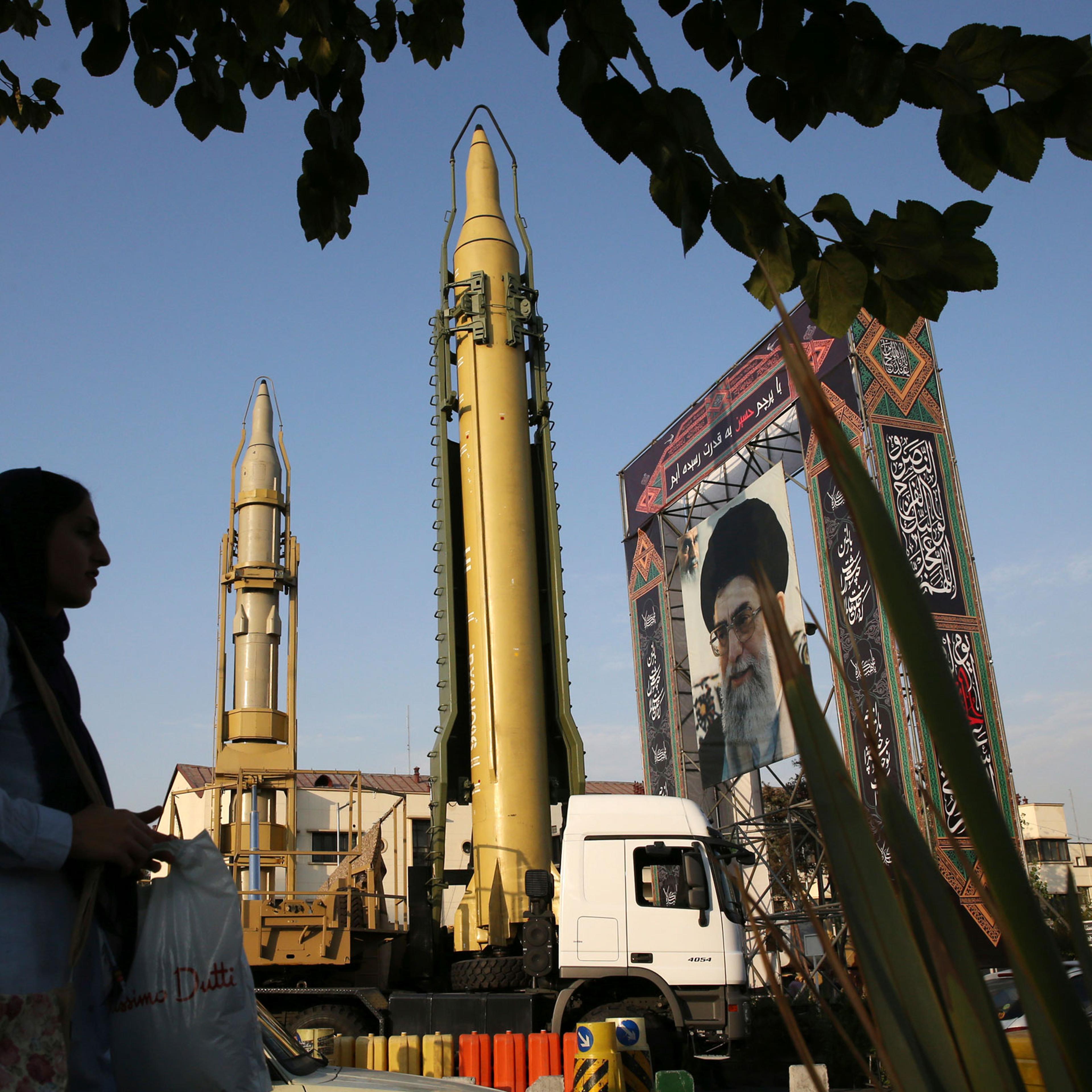 A Ghadr-H missle, center, a solid-fuel surface-to-surface Sejjil missile and a portrait of the Supreme Leader Ayatollah Ali Khamenei are on display in Tehran for the annual Defense Week in 2017