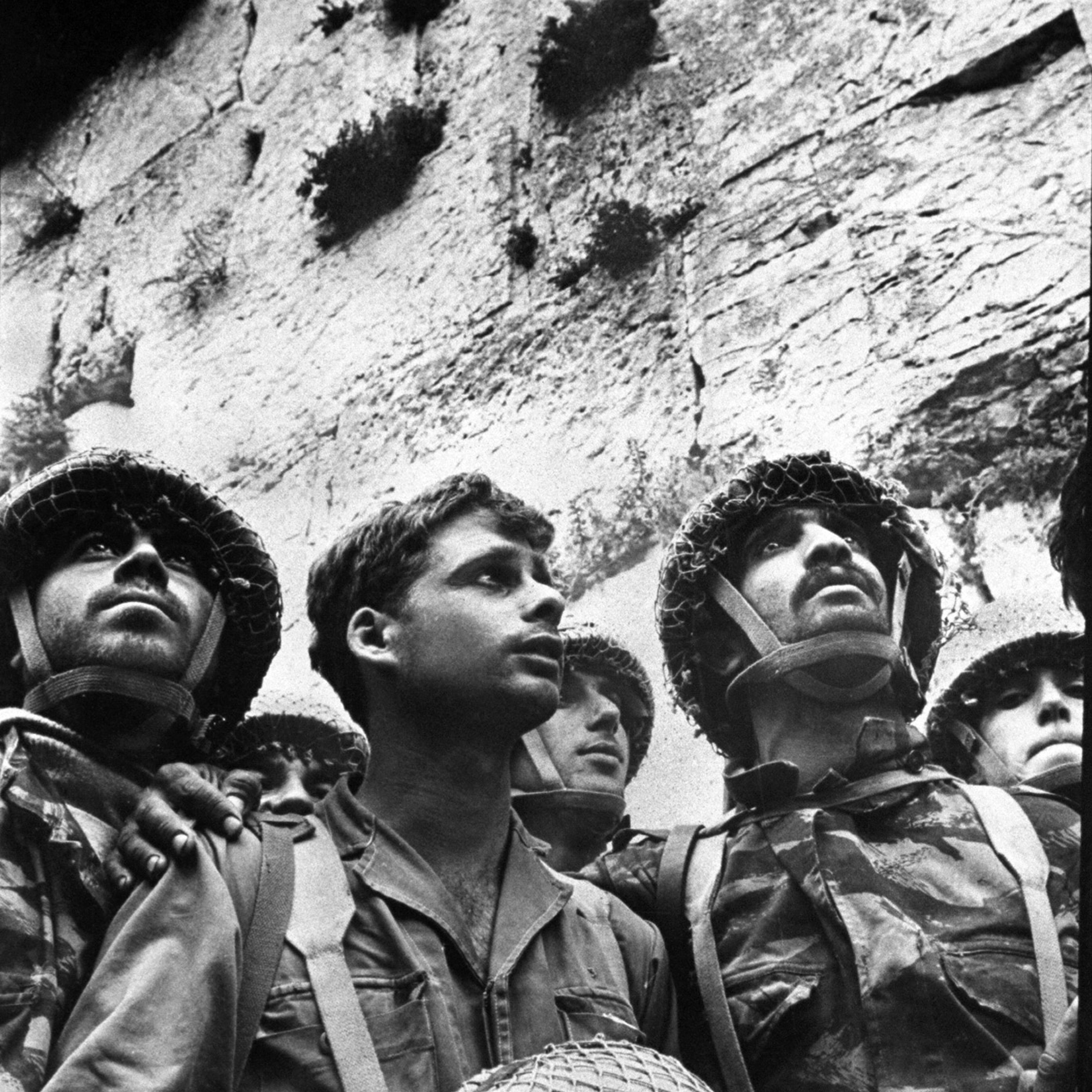 Small group of Israeli soldiers at the wailing wall after it was recaptured during the 1967 war.