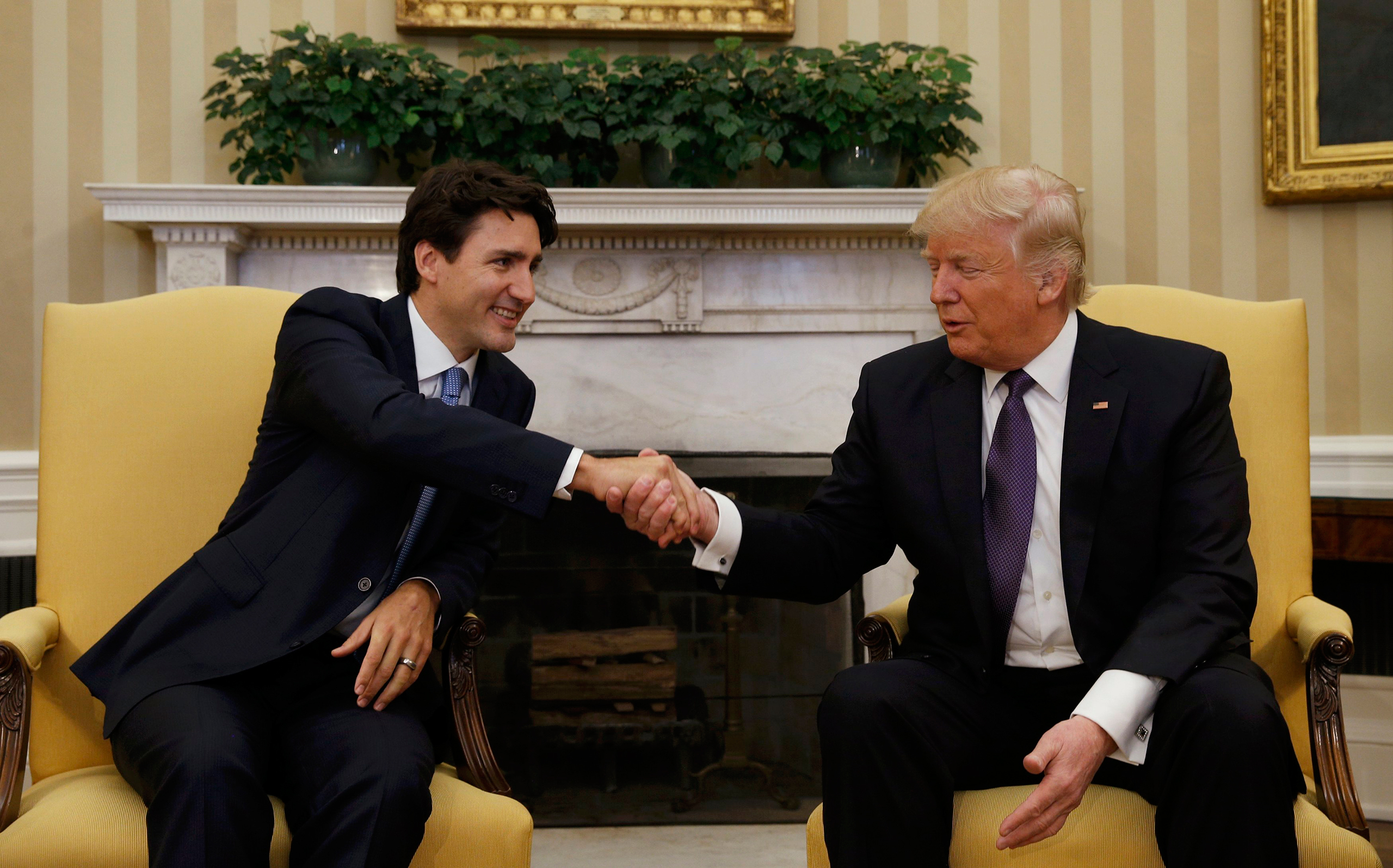 Canadian Prime Minister Justin Trudeau shakes hands with President Donald Trump in the Oval Office at the White House on Feb. 13, 2017.