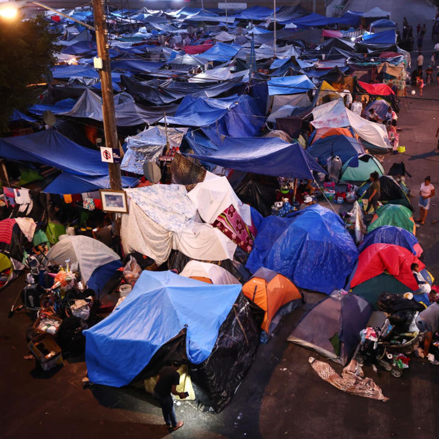 Migrants Huddle In Camps And Shelters In Tijuana Waiting To Cross Into U.S.