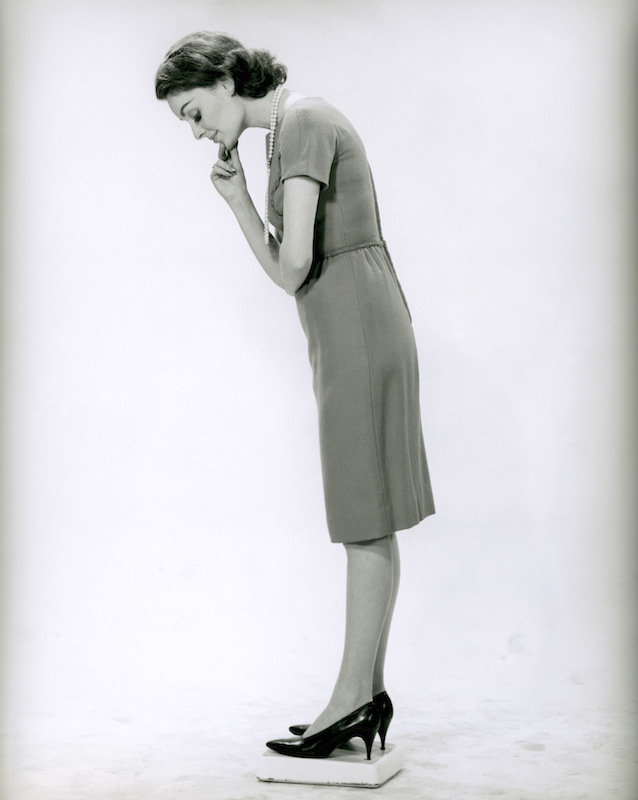 Woman standing on scale
