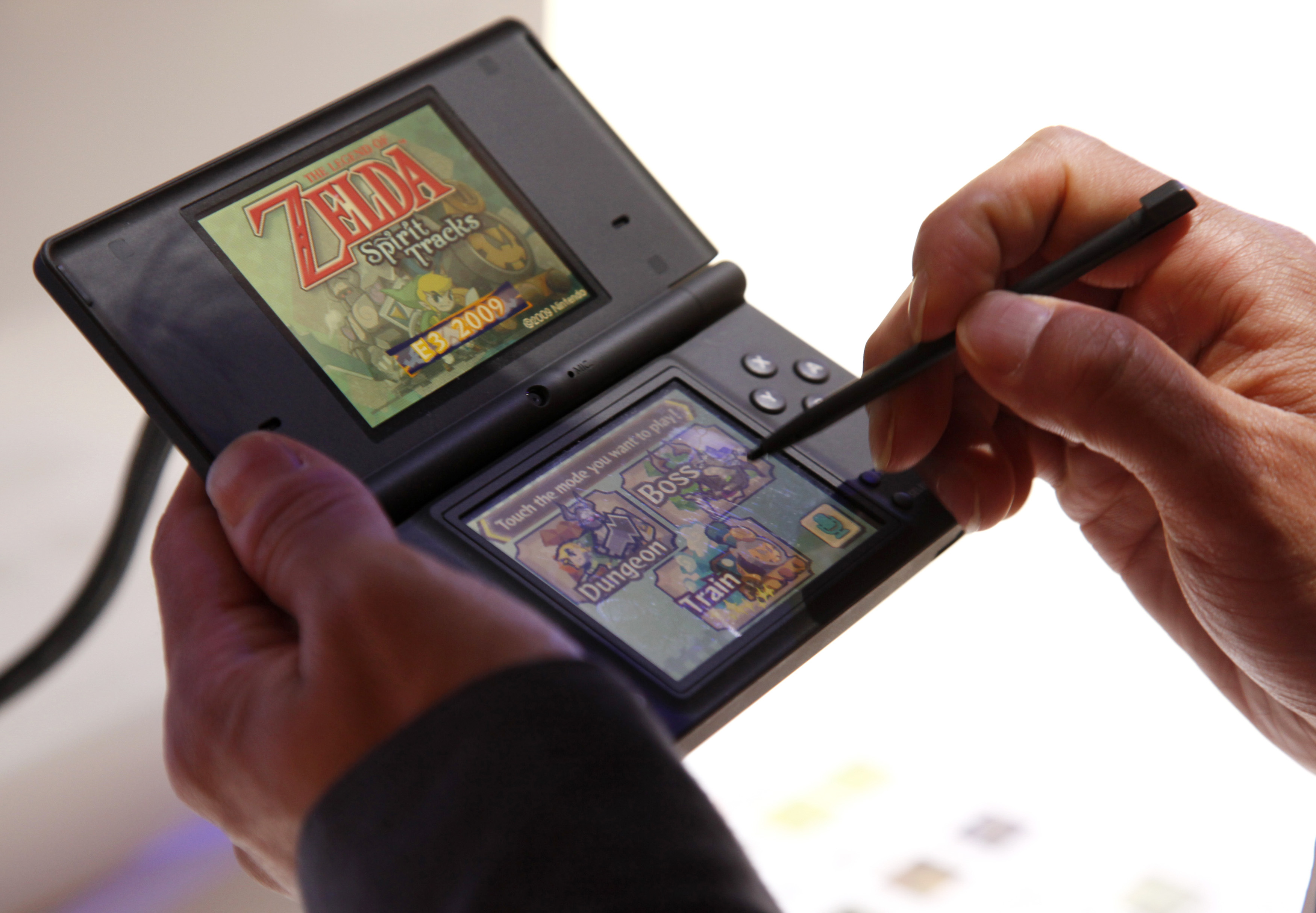 This June 3, 2009 photo shows a visitor playing "The Legend of Zelda: Spirit Tracks" video game on the Nintendo DS during the Electronic Entertainment Expo in Los Angeles.