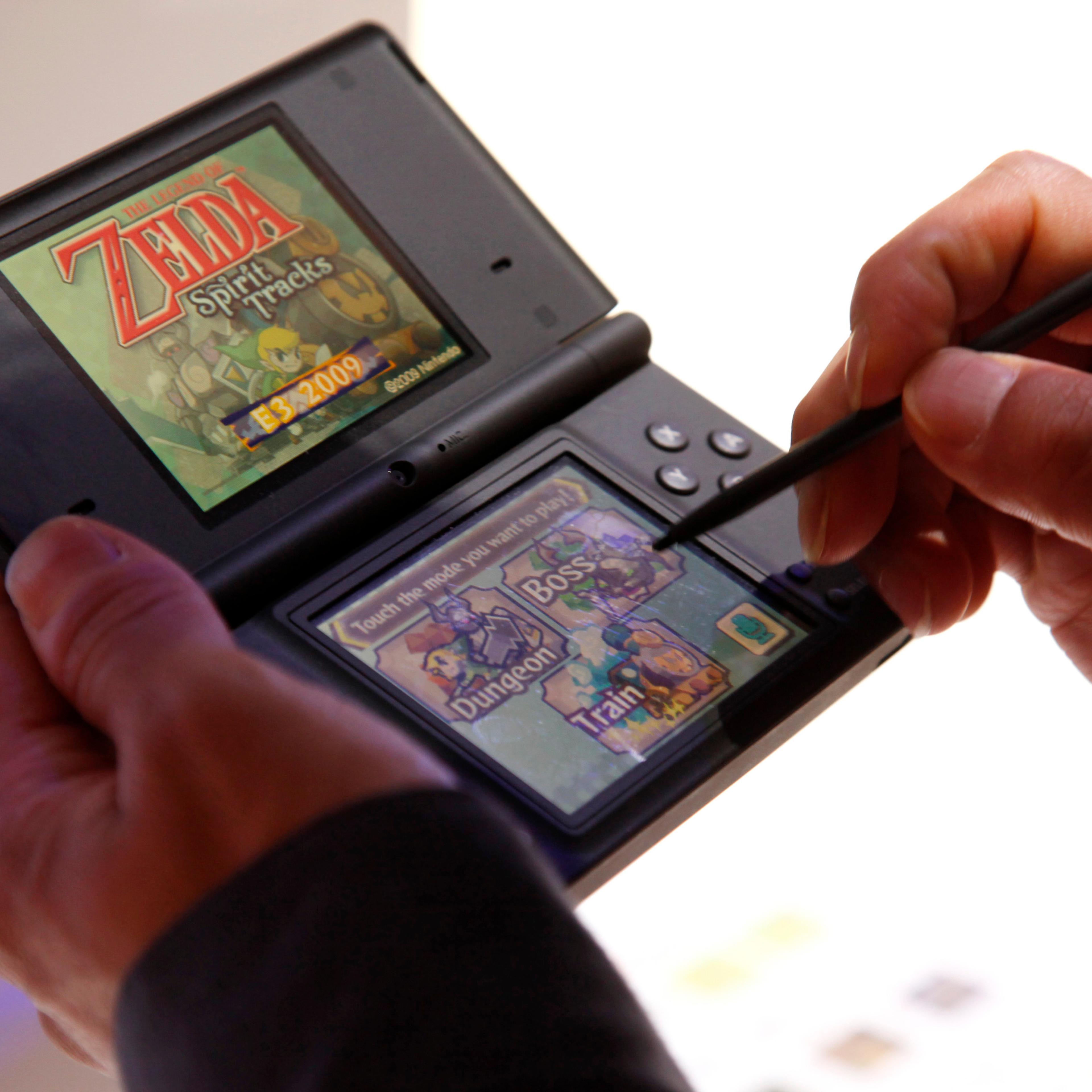 This June 3, 2009 photo shows a visitor playing "The Legend of Zelda: Spirit Tracks" video game on the Nintendo DS during the Electronic Entertainment Expo in Los Angeles.