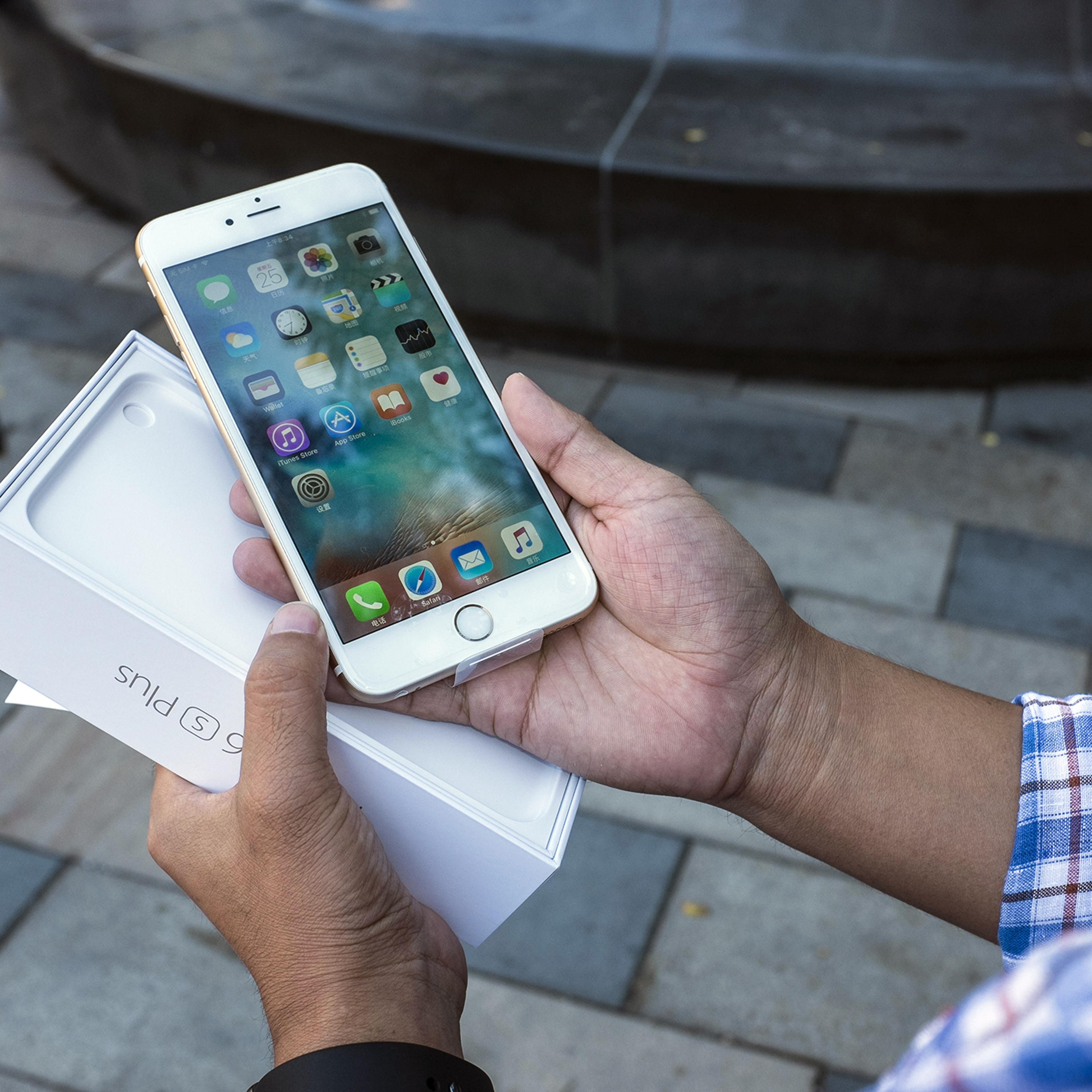 Customer who just purchased Apple's iPhone 6s in Beijing Sanlitun Apple Store, Beijing, September 25, 2015.