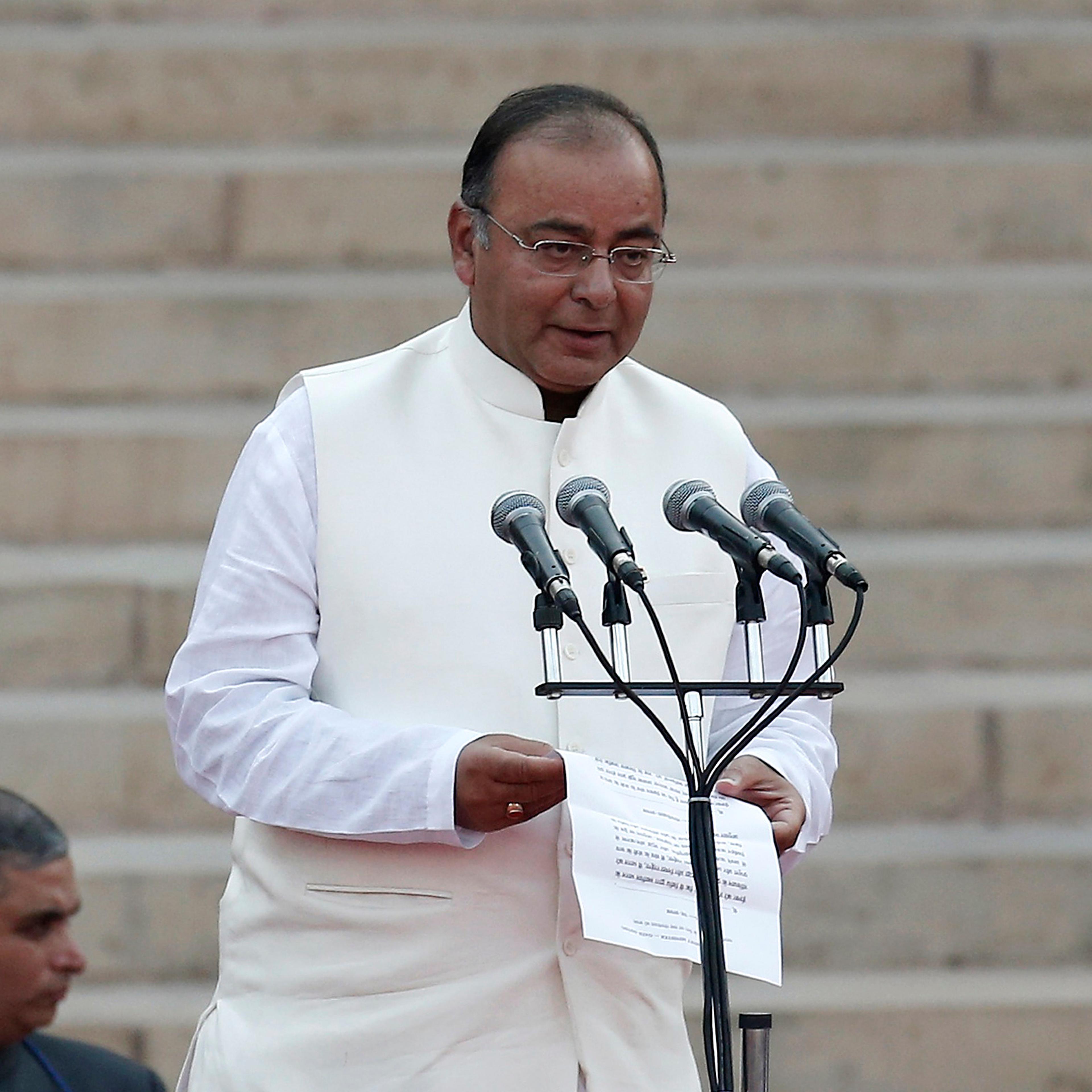 Jaitley is administered oath of office by India's President Mukherjee as a cabinet minister at the presidential palace in New Delhi