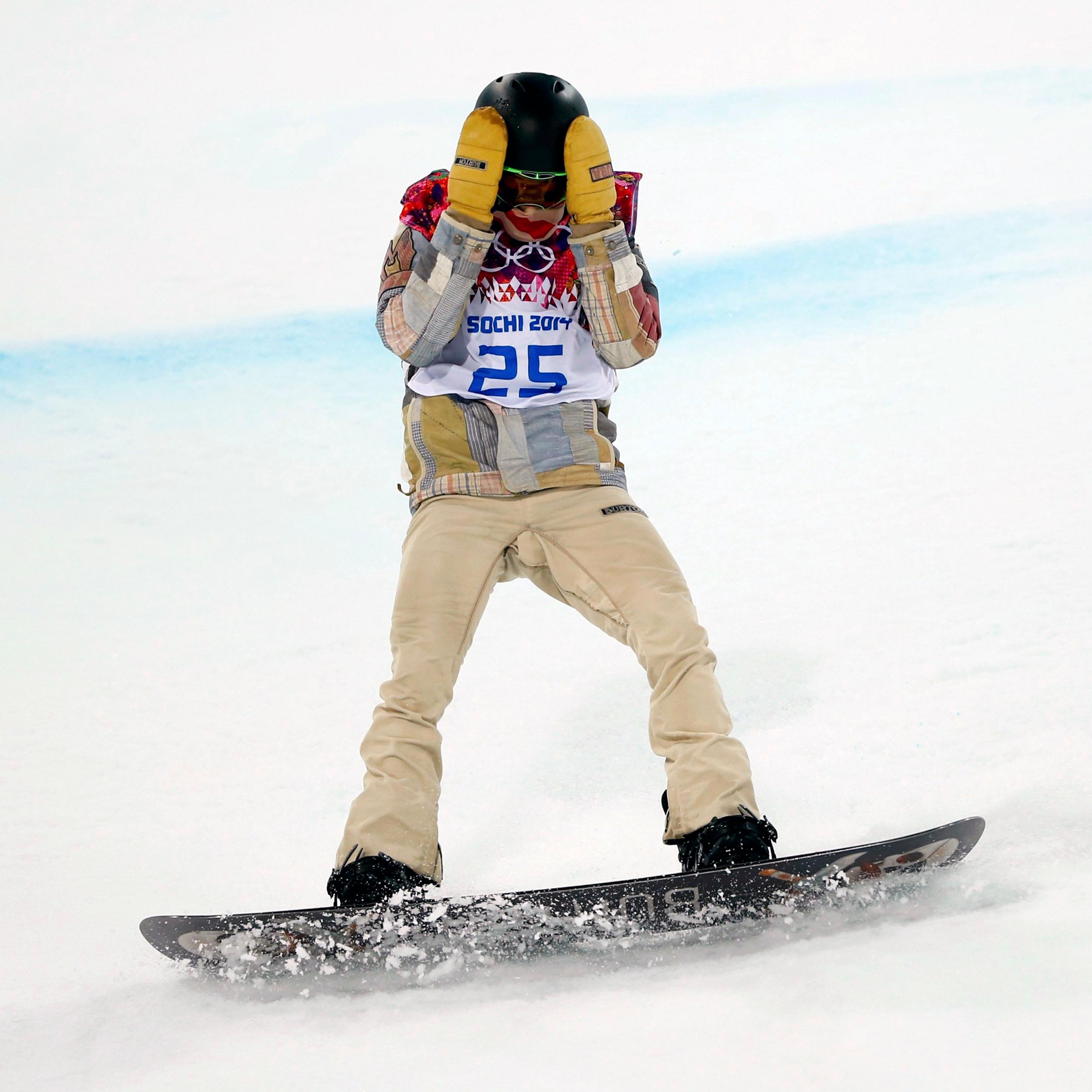 Shaun White of the U.S. reacts after crashing during the men's snowboard halfpipe final event at the 2014 Sochi Winter Olympic Games in Rosa Khutor