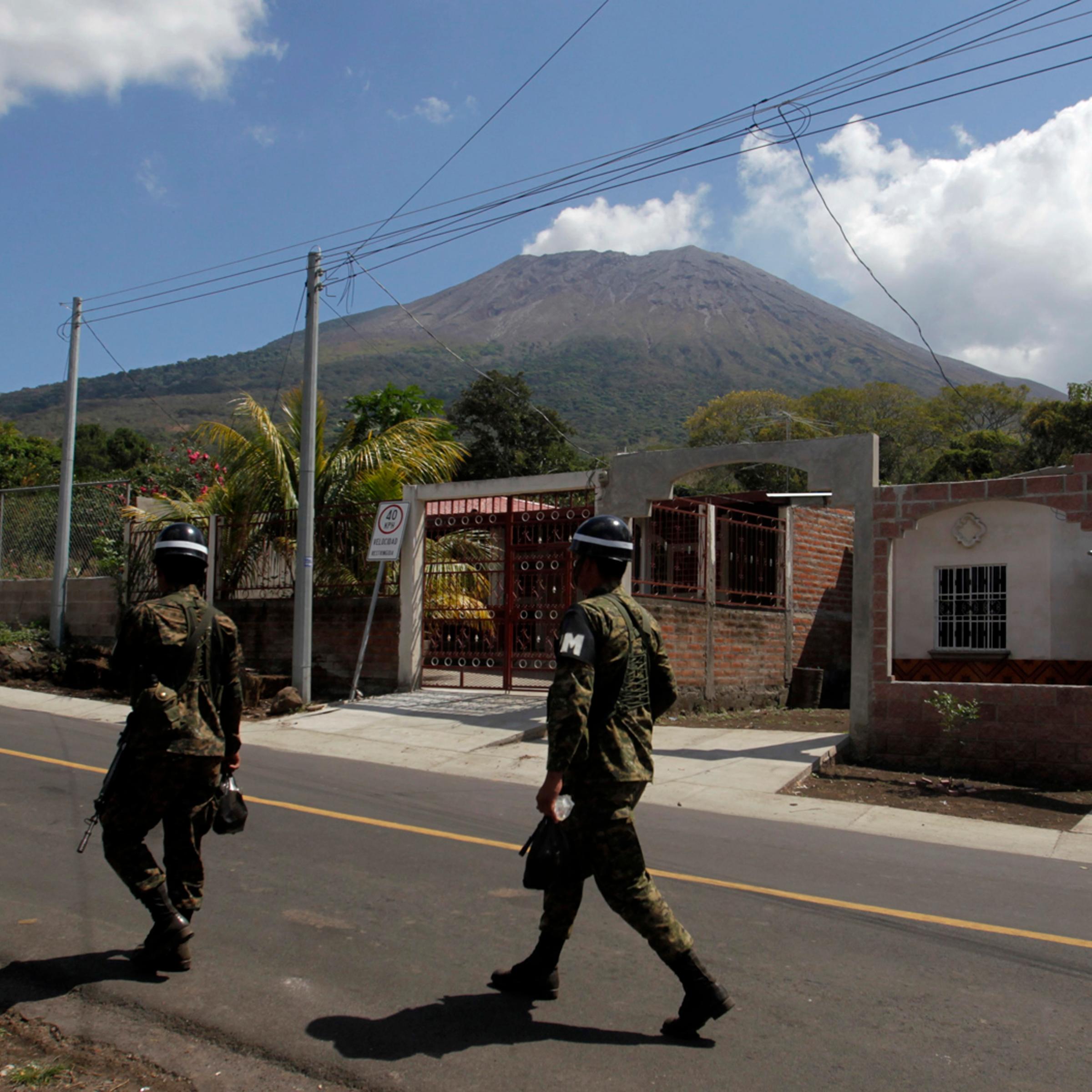 Soldier walk near the area of the Chaparrastique volcano in the municipality of Placitas outside San Salvador