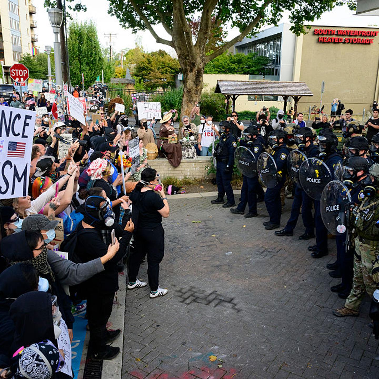 Federal agents confront protesters outside of the U.S. Immigration and Customs Enforcement building on Sept. 28, 2025 in Portland, Ore.