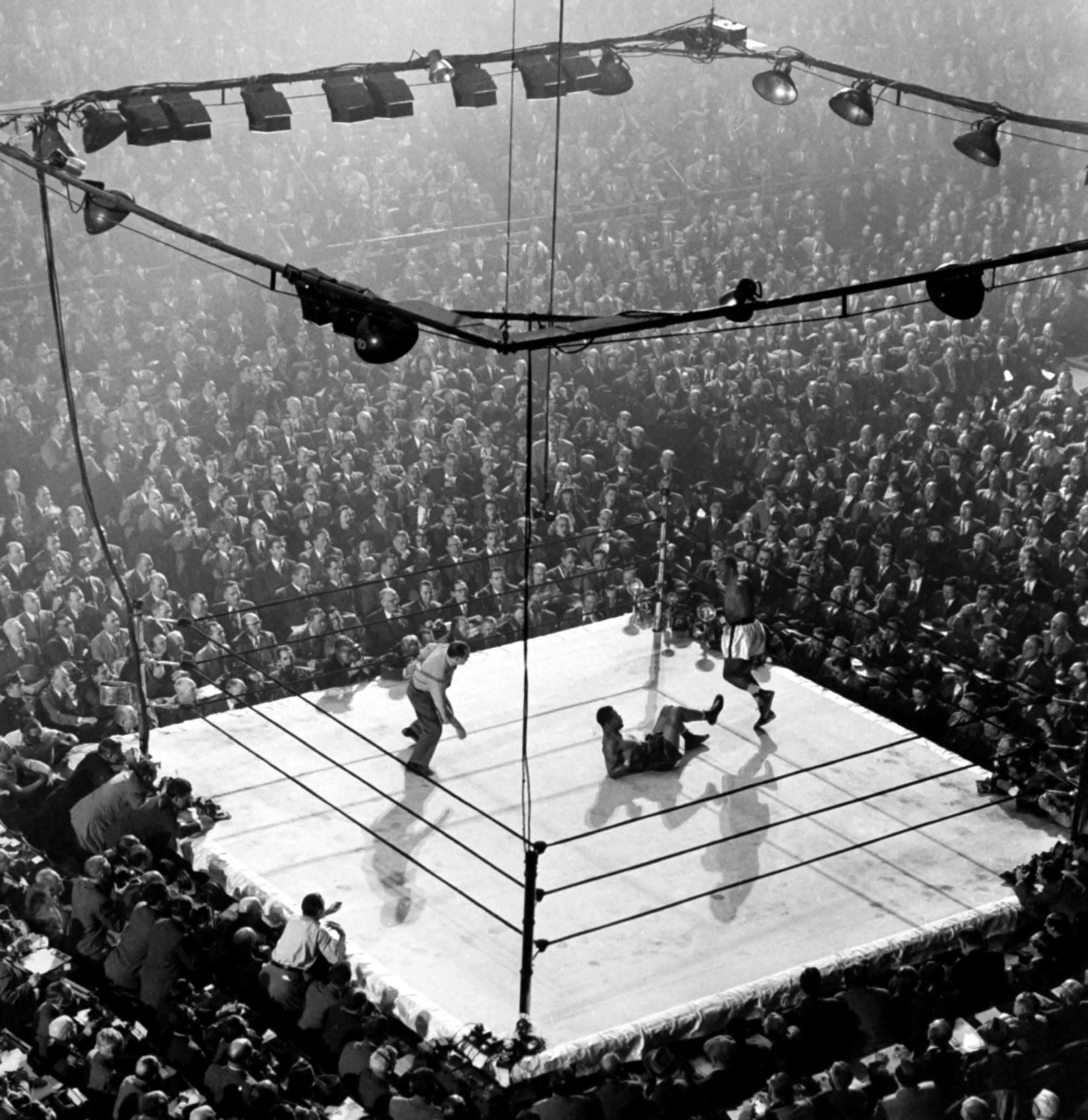 Heavyweight champ Joe Louis lies on the canvas at (the old, original) Madison Square Garden in New York after being floored by contender Jersey Joe Walcott in a December 1947 title match. Louis came back to win by a controversial decision. Originally pub
