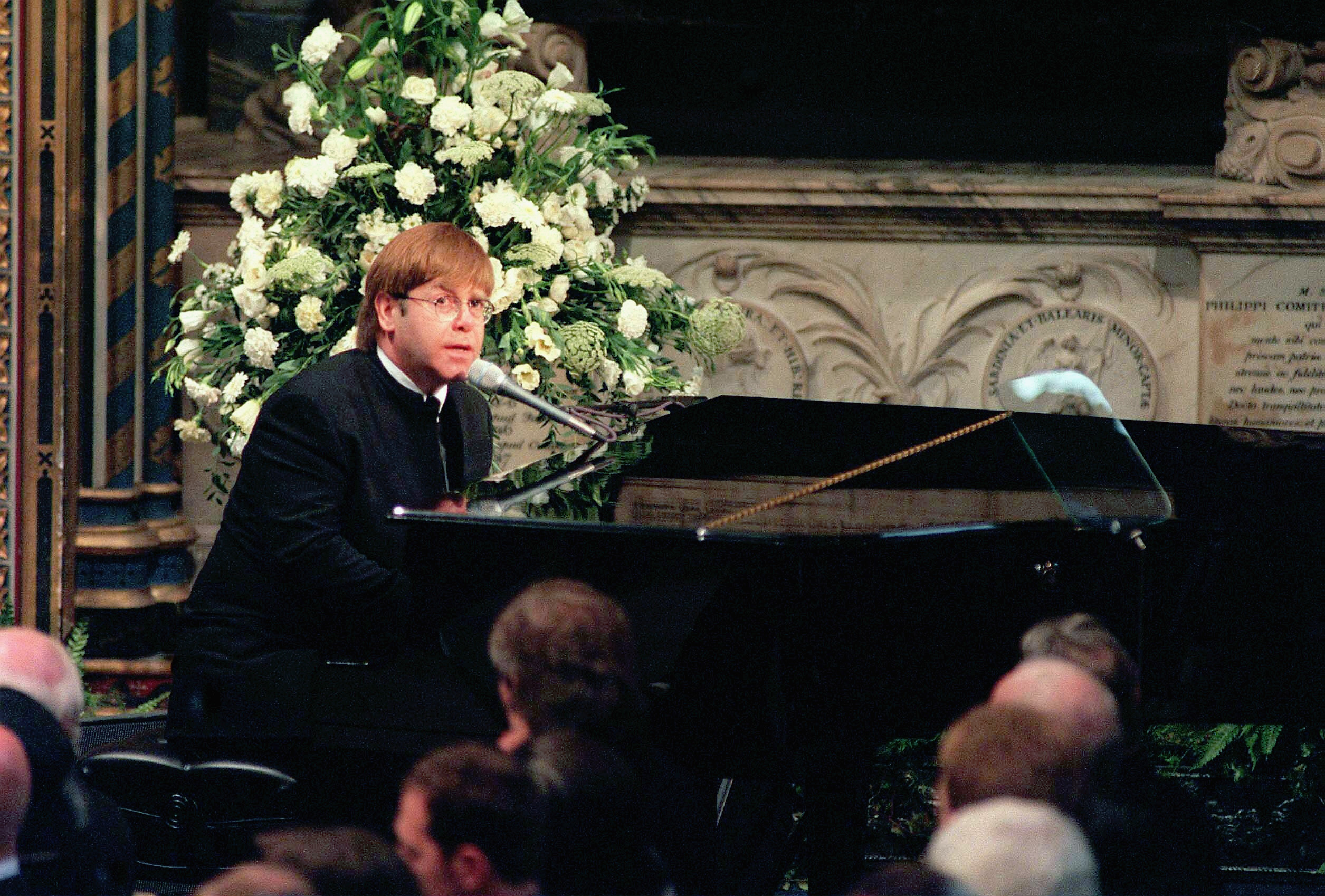 Sir Elton John sings 'Candle in the Wind' at the funeral of Diana, Princess of Wales at Westminster Abbey in 1997