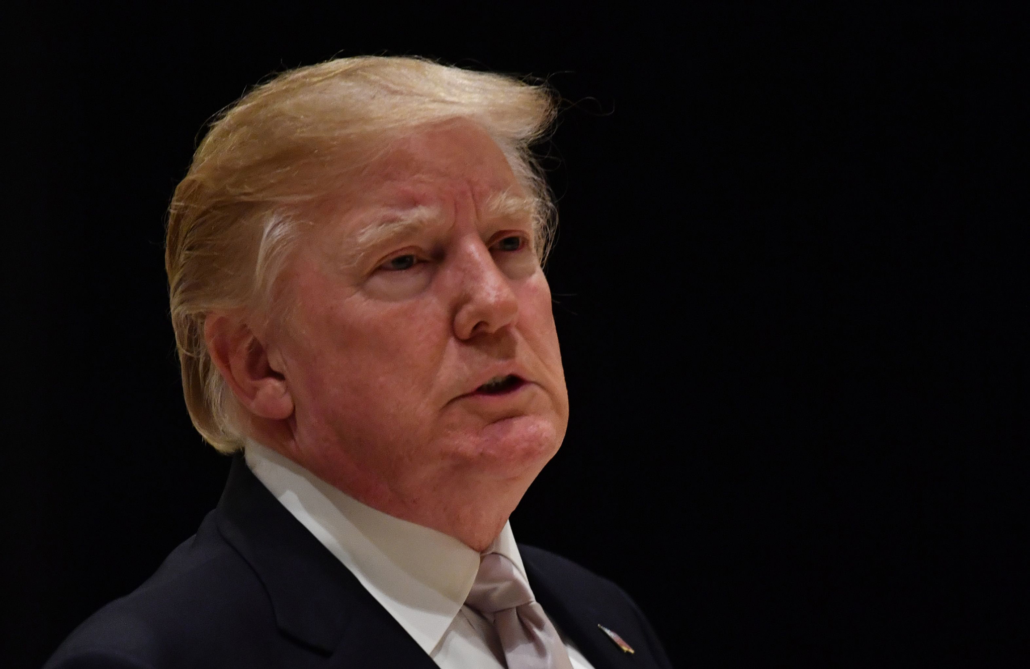 President Donald Trump speaks to reporters at Trump International Golf Club in West Palm Beach on Jan.14, 2018.