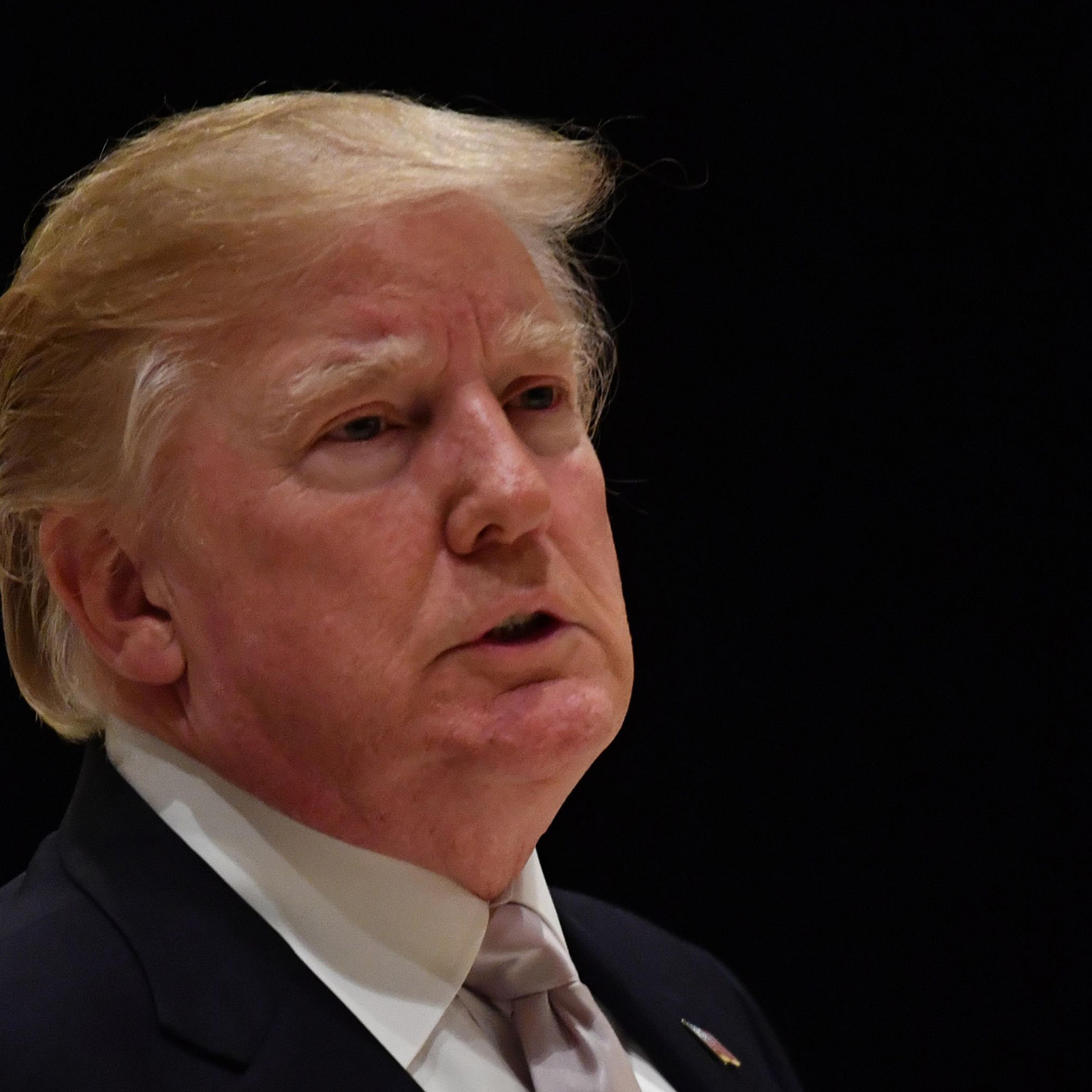 President Donald Trump speaks to reporters at Trump International Golf Club in West Palm Beach on Jan.14, 2018.