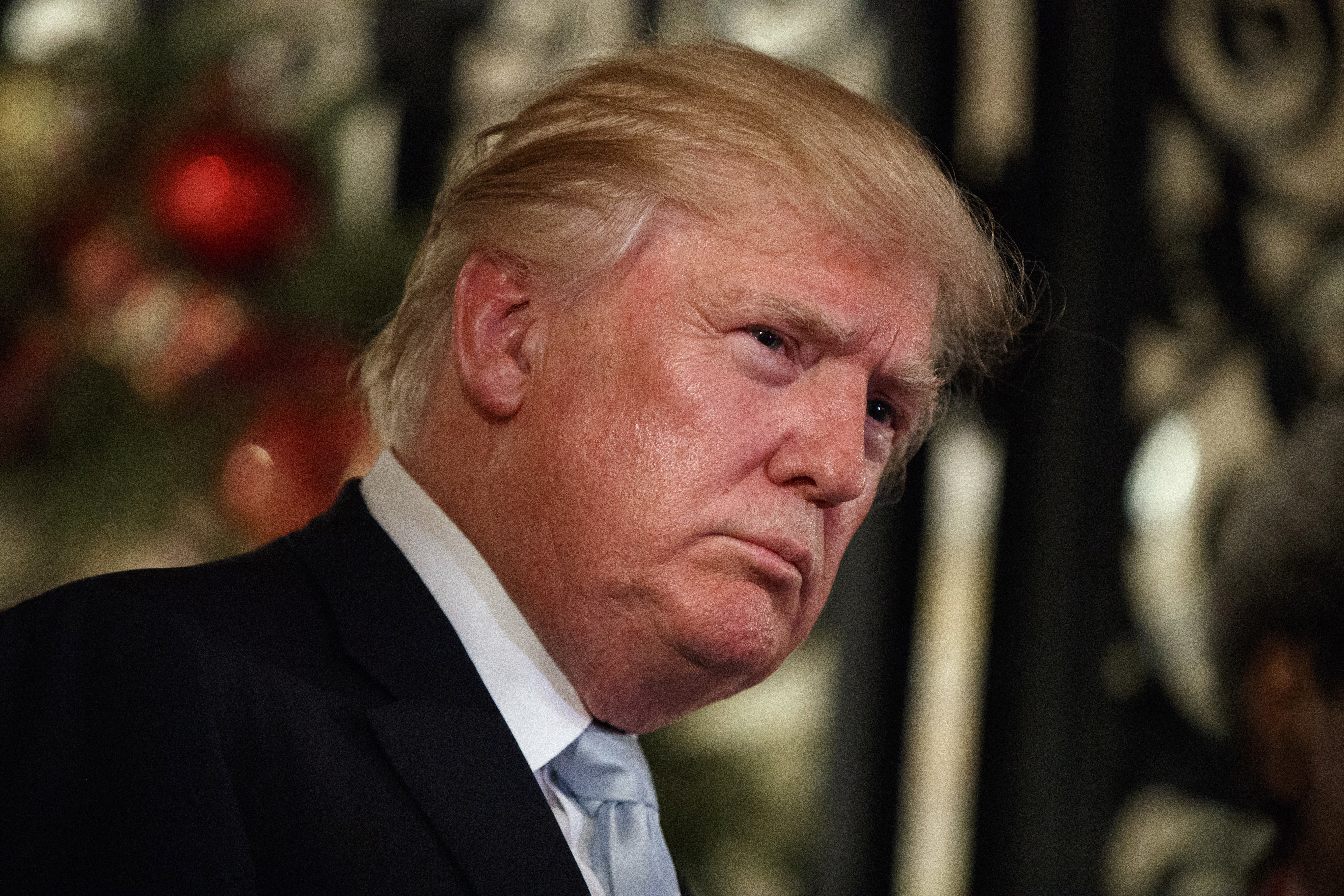 President-elect Donald Trump listens to a question as he speaks to reporters at Mar-a-Lago, Dec. 28, 2016, in Palm Beach, Fla.