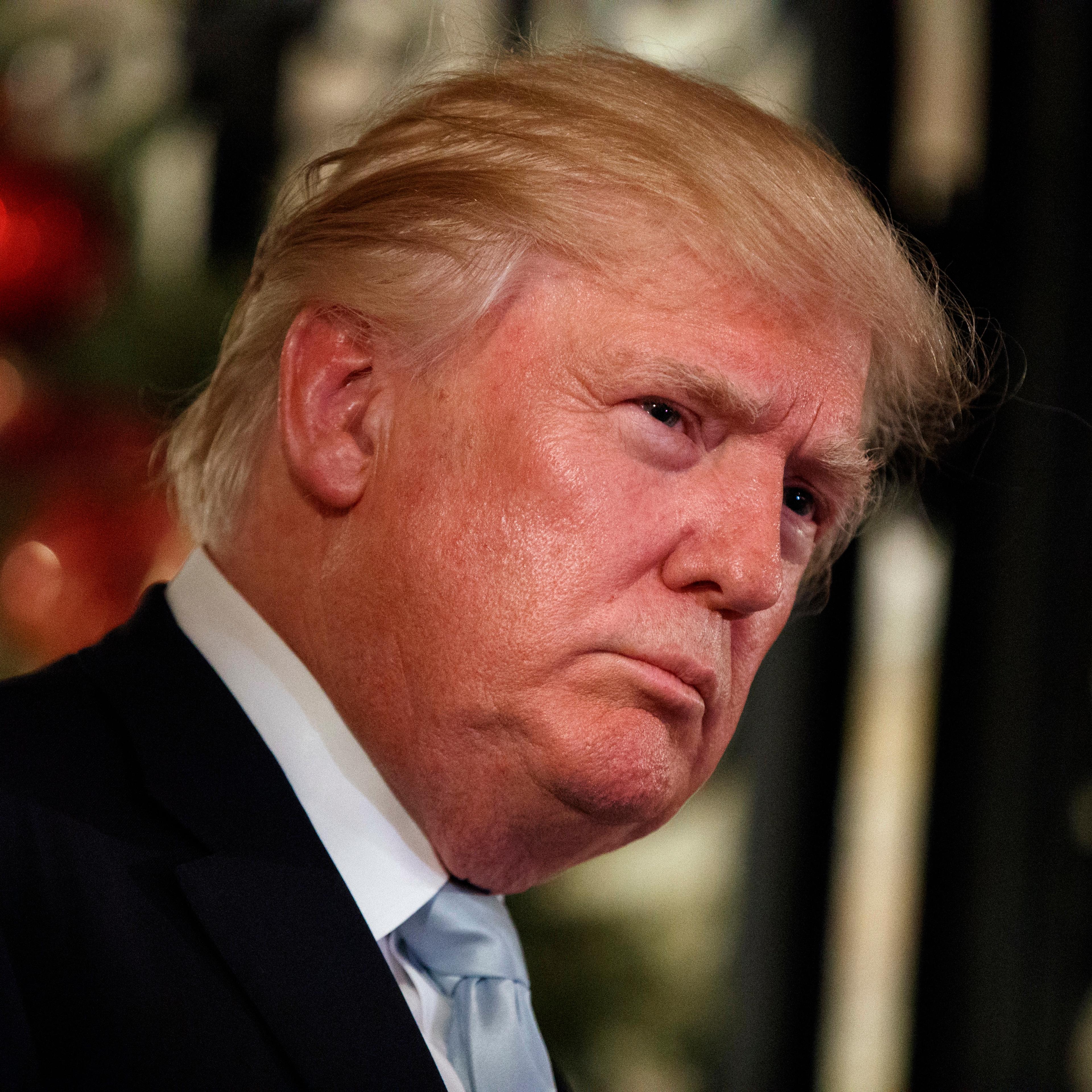 President-elect Donald Trump listens to a question as he speaks to reporters at Mar-a-Lago, Dec. 28, 2016, in Palm Beach, Fla.