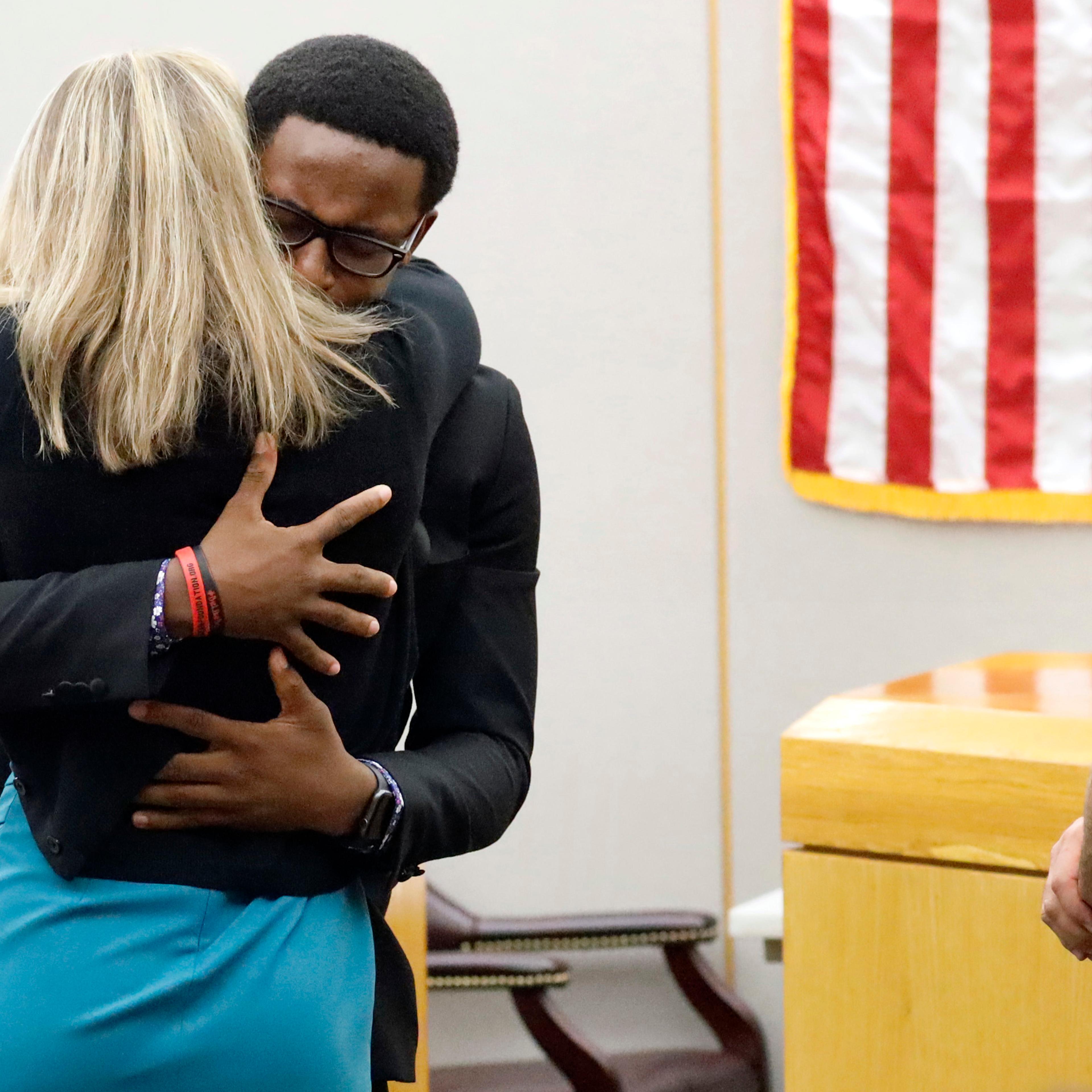 Botham Jean's brother hugs Amber Guyger