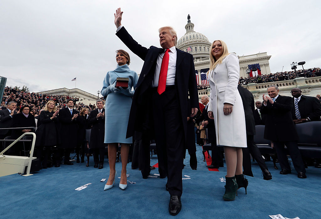 U.S. President Donald Trump acknowledges the audience after taking the oath of office as his wife Melania (L) and daughter Tiffany watch during inauguration ceremonies swearing in Trump as the 45th president of the United States on the West front of the 