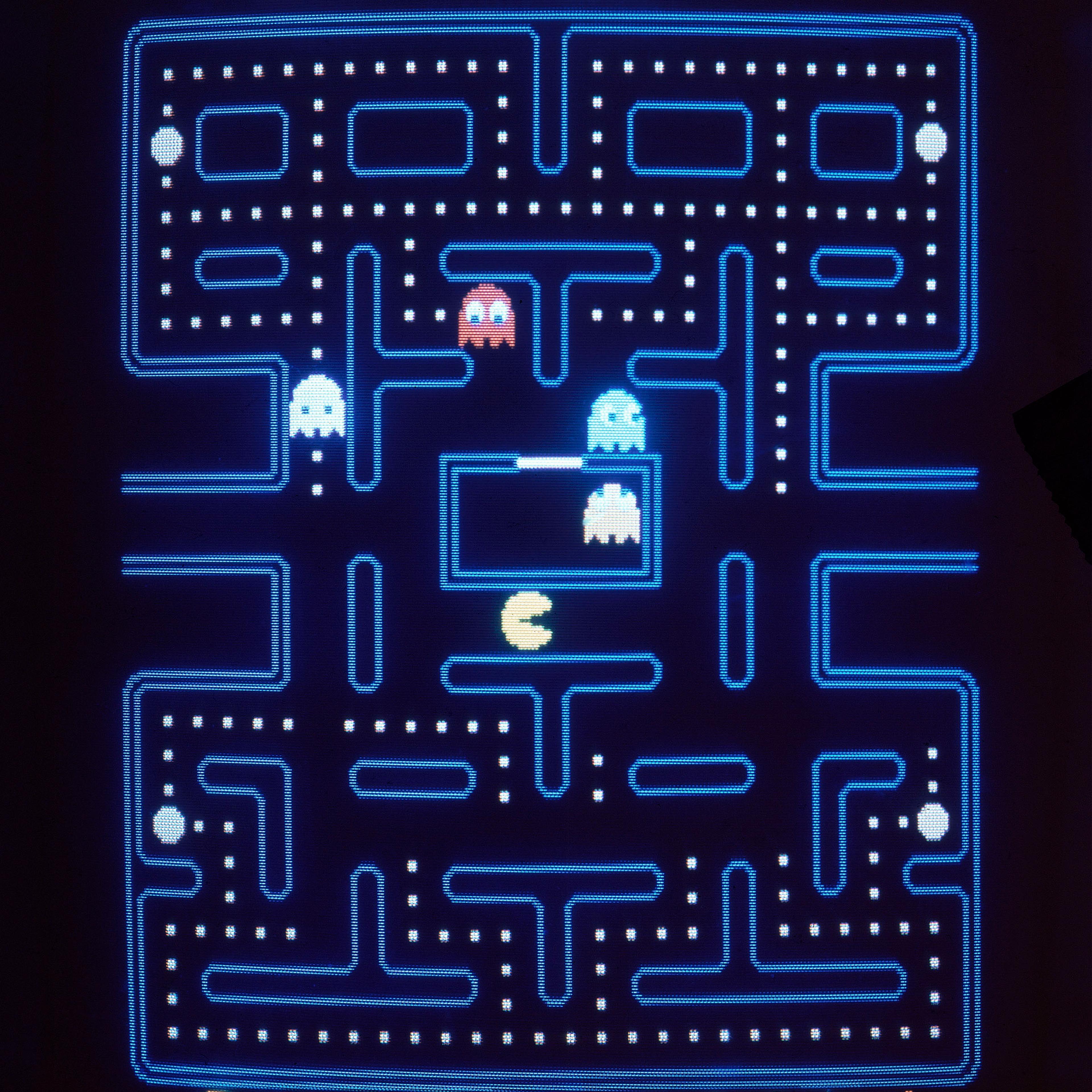 This close up view of a monitor shows the electronic video game Pac-Man in 1983.