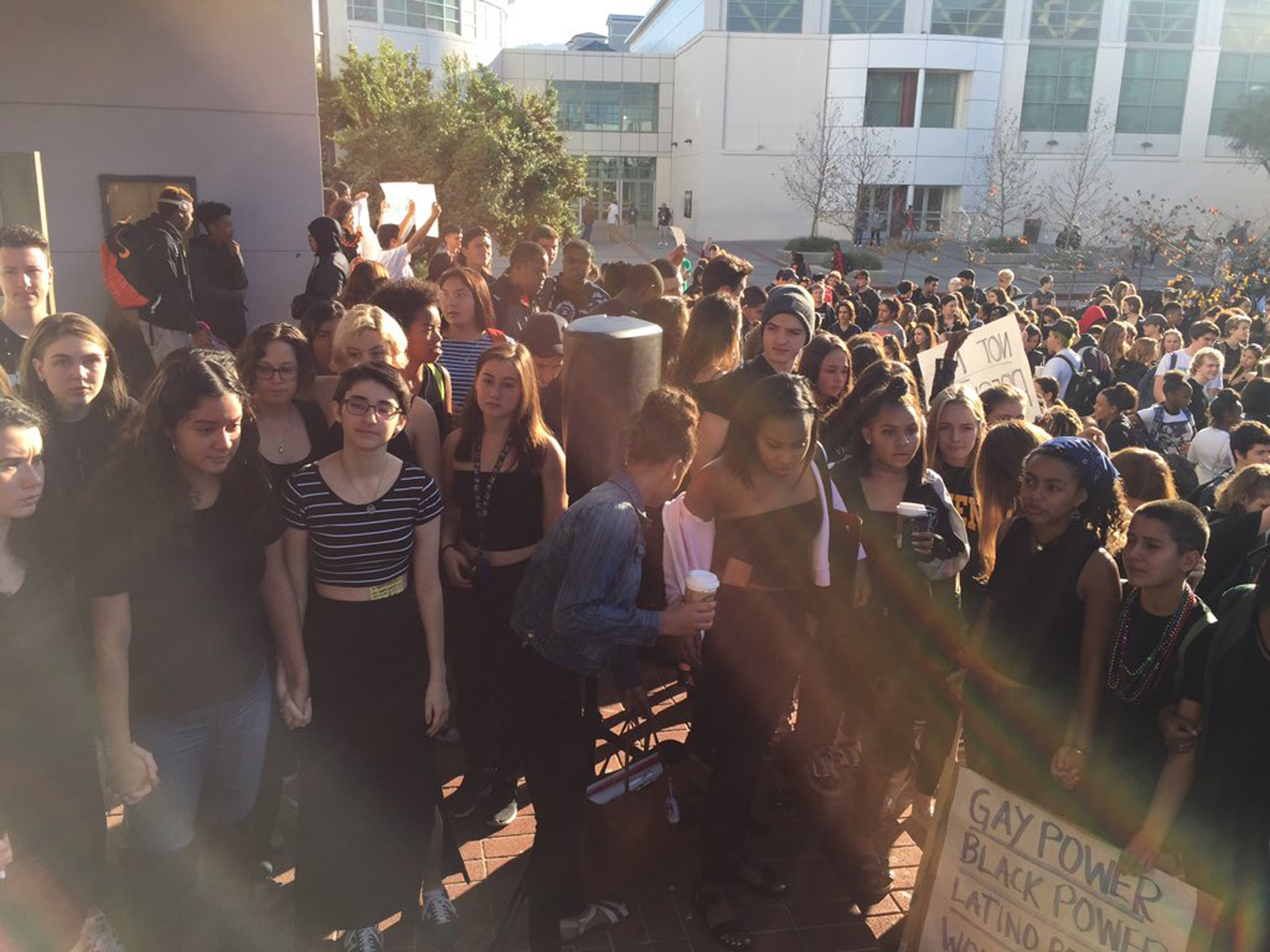 Lillian Weiner-Mock (third from left, in a striped top), co-head of the student body's Gay-Straight Alliance, stages a walk out with fellow students at Berkeley High School to protest against the presidential election of Donald Trump, in Berkeley, Calif., on Nov. 9, 2016.