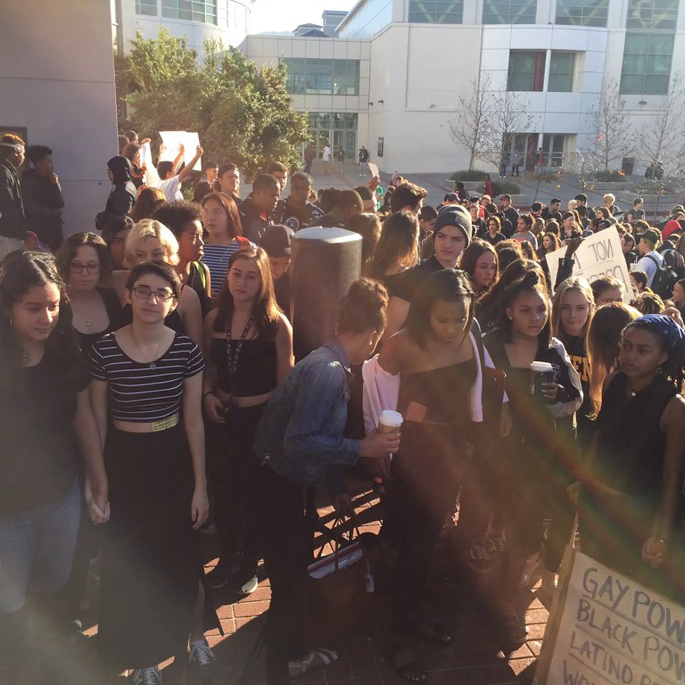 Lillian Weiner-Mock (third from left, in a striped top), co-head of the student body's Gay-Straight Alliance, stages a walk out with fellow students at Berkeley High School to protest against the presidential election of Donald Trump, in Berkeley, Calif., on Nov. 9, 2016.