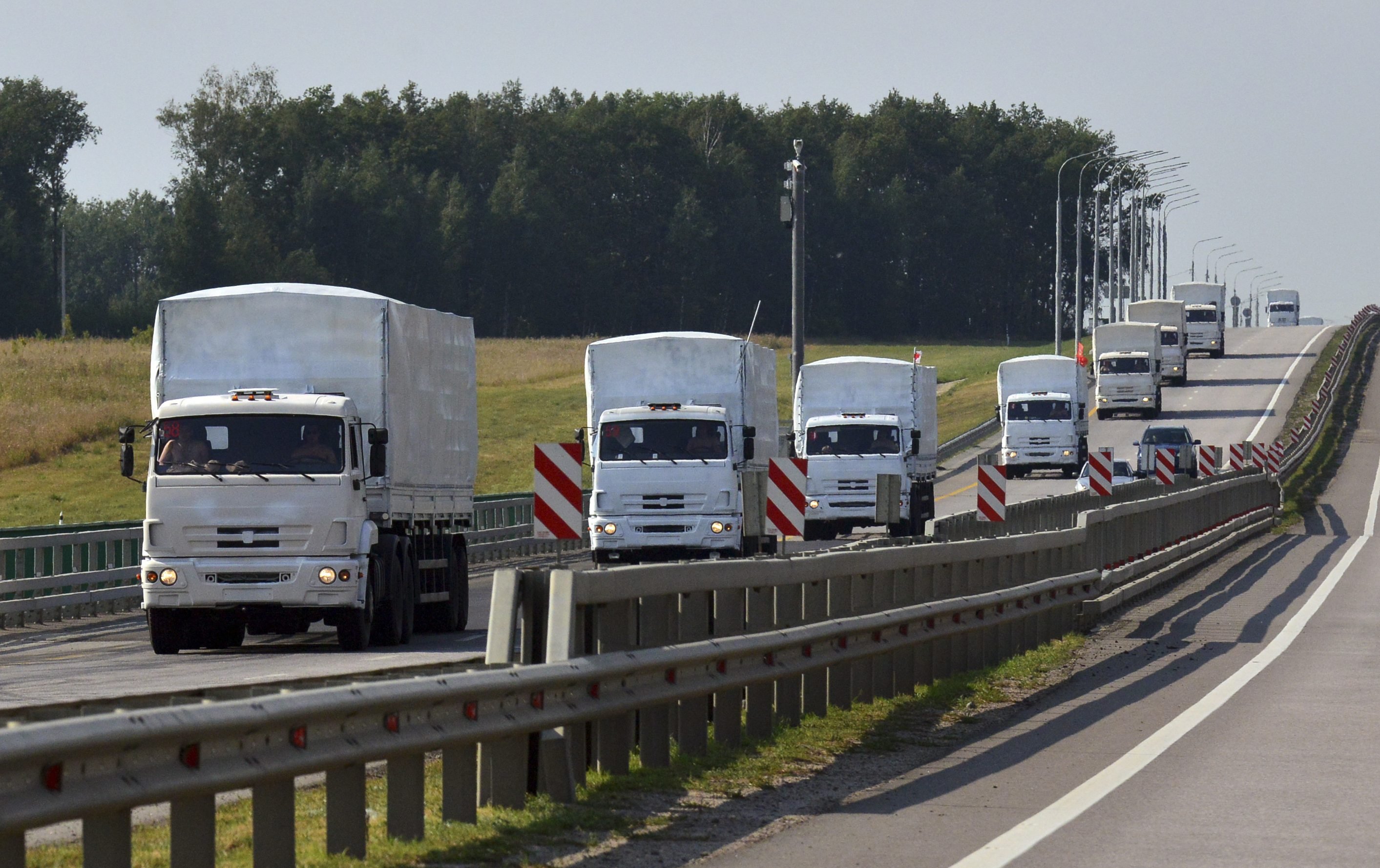 A Russian convoy of trucks carrying humanitarian aid for Ukraine drives along a road near the city of Yelets August 12, 2014.