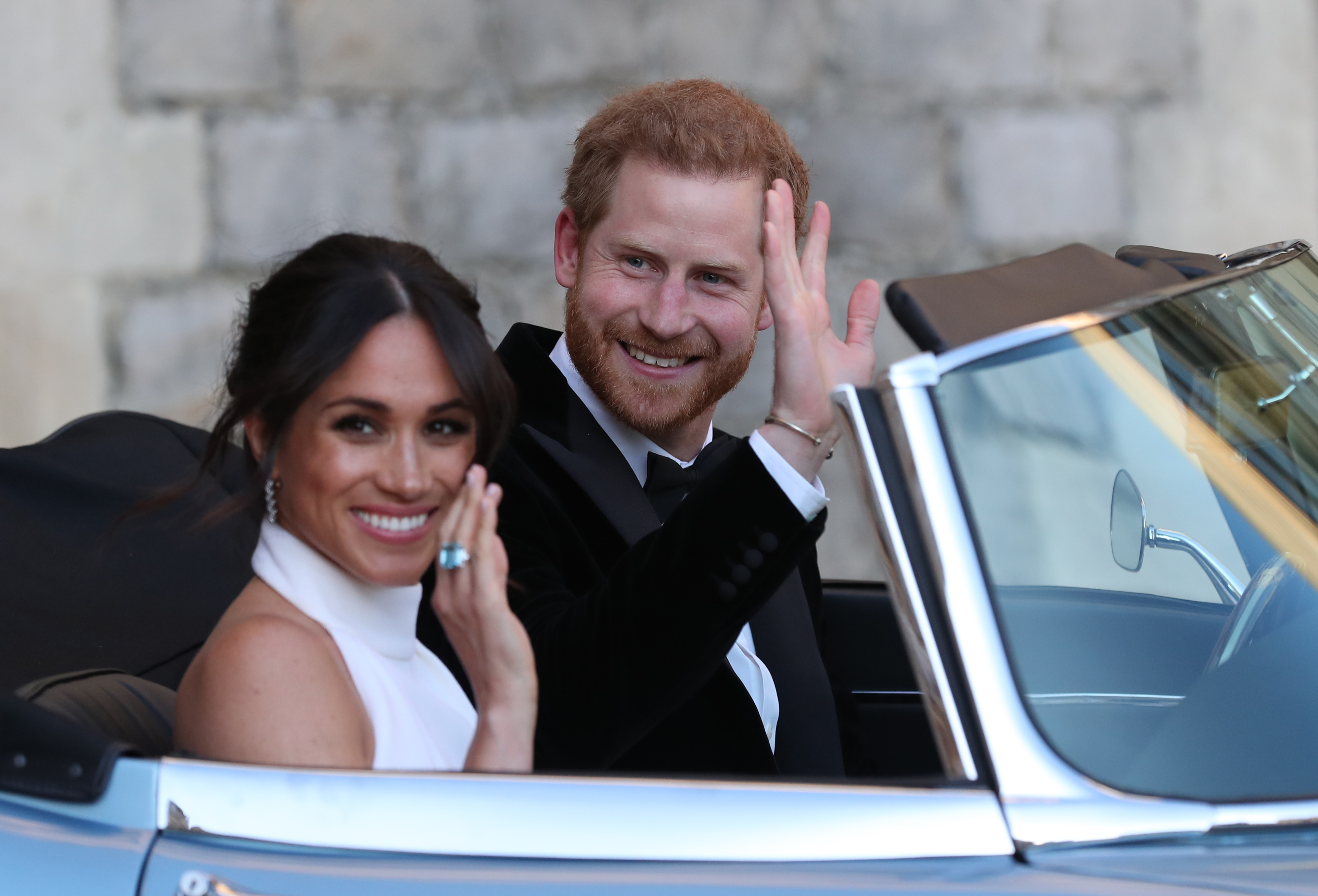 Meghan Markle and Prince Harry leave for royal wedding reception