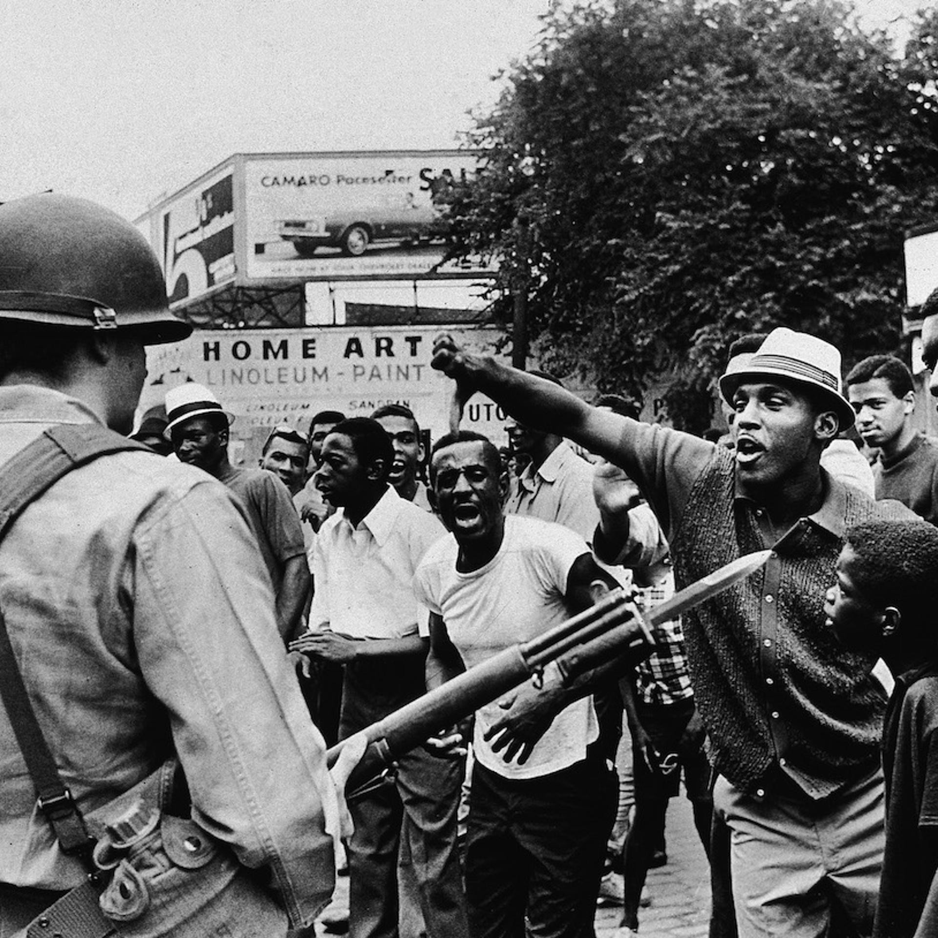 Man Gives Black Power Salute To National Guard