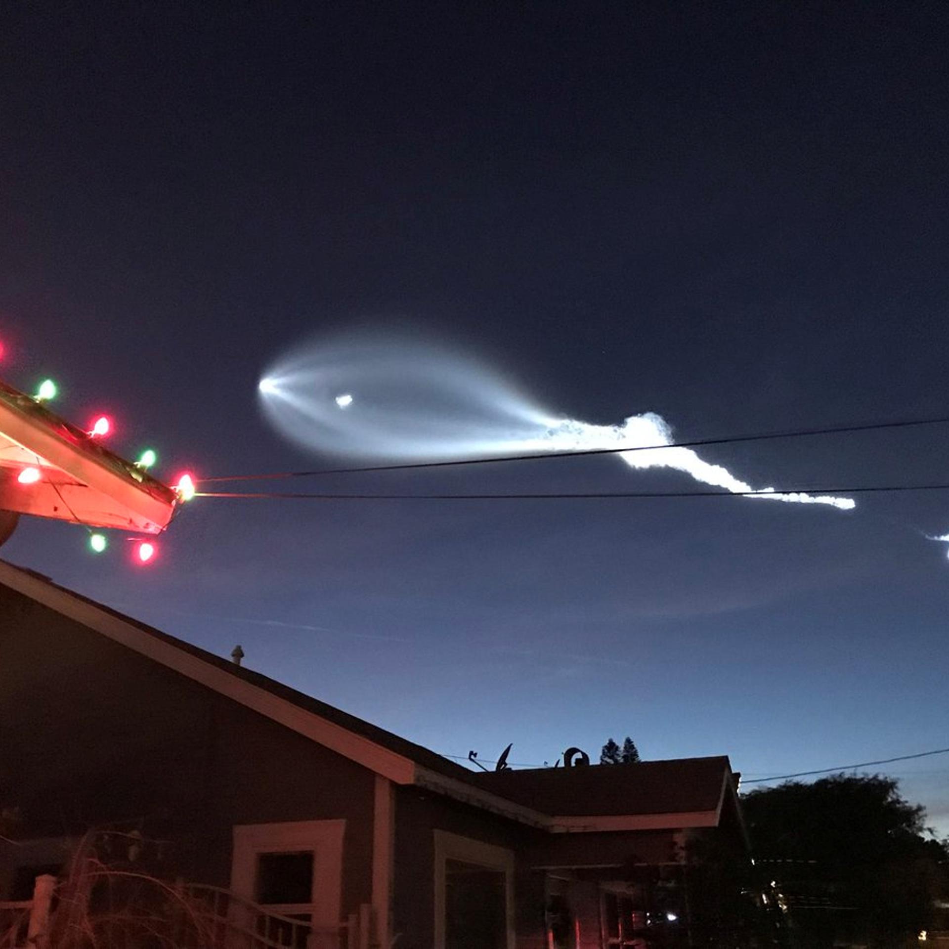 SpaceX's Falcon 9 rocket lifts off in the air, as seen from El Sugundo, California