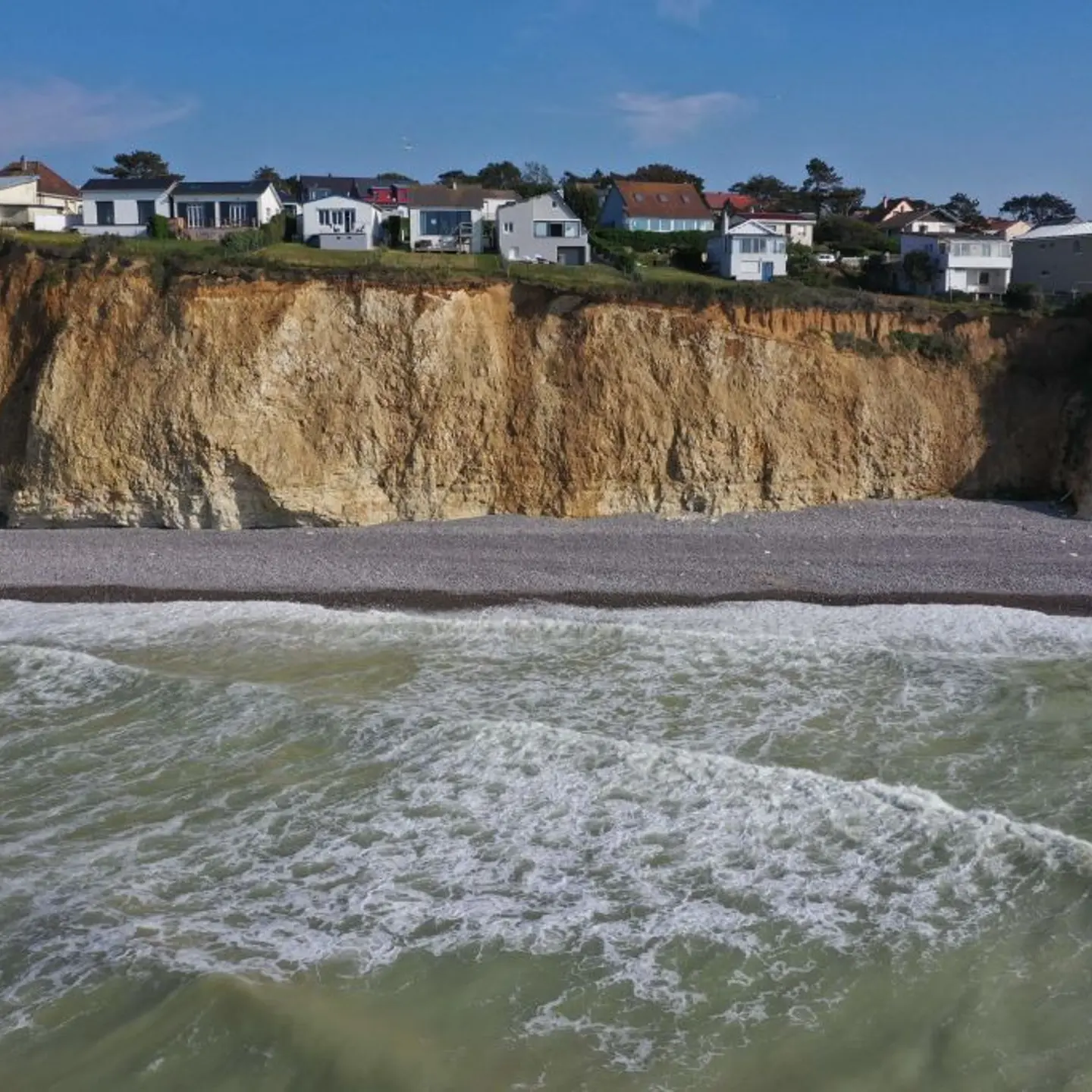 Global warming, accompanied by rising sea levels, increases risk of flooding, erosion, and cliff collapse on the Normandy coast in France, as shown on June 22, 2022.